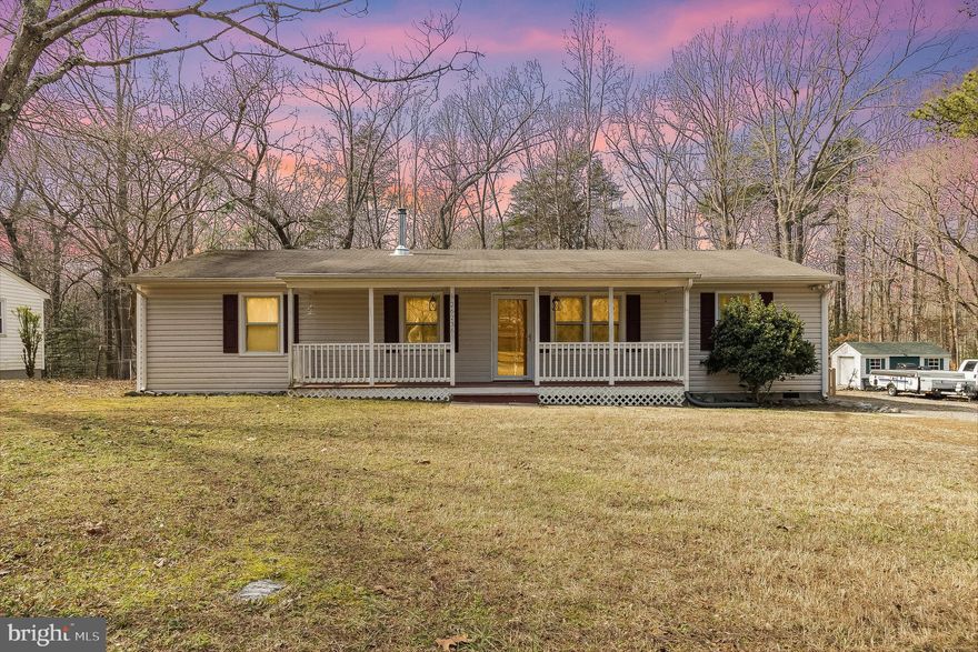 Perfect starter home with an open floor-plan and split bedroom layout with a cabin like feel and a large front porch.  The kitchen has updated cabinetry and  there are LVP floors throughout the main living spaces.  Both bathrooms have updated vanities.  The master bathroom exhaust fan doubles as a bluetooth speaker.  You will get lots of enjoyment from the large, flat backyard that is fully-fenced and even includes some grape vines on the right side of the property!  The shed in the back yard is no ordinary shed.   It is half workshop with plenty of power and lights (including a light that doubles as a bluetooth speaker).   The other side of the shed is a small studio with a mini-split HVAC system, recessed lights and very comfortable interior finishes with a window and a windowed entry door!   The washer and dryer convey with an acceptable offer.