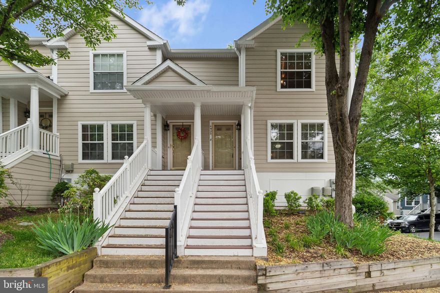 This charming three bedroom, two full and one-half bath townhome is located in Dorsey Hall. Embrace upscale, low-maintenance townhouse living in this light-filled end-unit! This home offers the perfect blend of functionality and comfort. Step inside and admire gleaming hardwood floors throughout the main level, anchored by a cozy wood-burning fireplace in the living room. The open floor plan seamlessly connects the living room to the dining room, creating a perfect entertaining space. The chef's kitchen boasts granite countertops, a center island breakfast bar and stainless-steel appliances. Unwind in the spacious primary suite with ensuite bathroom. Two additional bedrooms and a full hall bath provide ample space for family or guests. Enjoy evenings relaxing on the front porch or the expansive rear deck, both overlooking professionally landscaped grounds. This end-unit offers additional privacy and the convenience of off-street parking. Don't miss your chance to make this move-in-ready gem your new home! Conveniently located close to major thoroughfares, shopping, dining and recreation, this home is A MUST SEE!​ ***Assigned parking spot #33***