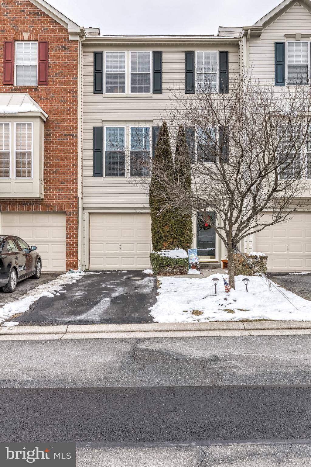 Fantastic garage townhome with THREE level bump out. Recently remodeled kitchen with new tile floor, granite, & SS appliances. Large deck off of family/sun room that backs to nature filled wooded area. Master suite with walk in closet and master super bath. Everything is neutral and move in ready.