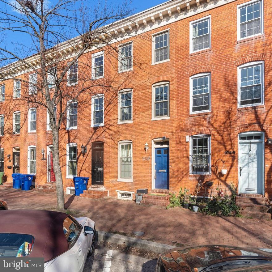 Welcome to 1048 W. Barre Street, a classic rowhouse offering 1300 square feet of living space in the heart of historic Barre Circle. This home blends timeless character with thoughtful updates, featuring exposed brick, hardwood floors, wood burning fireplaces, and a welcoming kitchen with granite countertops and stainless steel appliances. The main level offers living and dining spaces that flow naturally together, while multiple levels provide flexibility with four bedrooms and a finished lower level ideal for a home office, media room, or guest space. 

Step outside to enjoy a private deck and yard with the bonus of catching fireworks from Camden Yards and music from nearby stadium concerts. Parking is easy with neighborhood permit street parking plus access to a resident only parking lot with rear entry. Located on a quiet, tree lined one way street, this home sits within Barre Circle, one of Baltimore’s hidden gems known for its 19th century rowhomes, pocket park, and strong voluntary community association. Just blocks from Camden Yards, M&T Bank Stadium, the University of Maryland campus and medical system, and the Inner Harbor, the location offers easy access to 95, MARC trains, and BWI. The property is eligible for Healthy Neighborhoods incentives and the University of Maryland Live Near Your Work program.