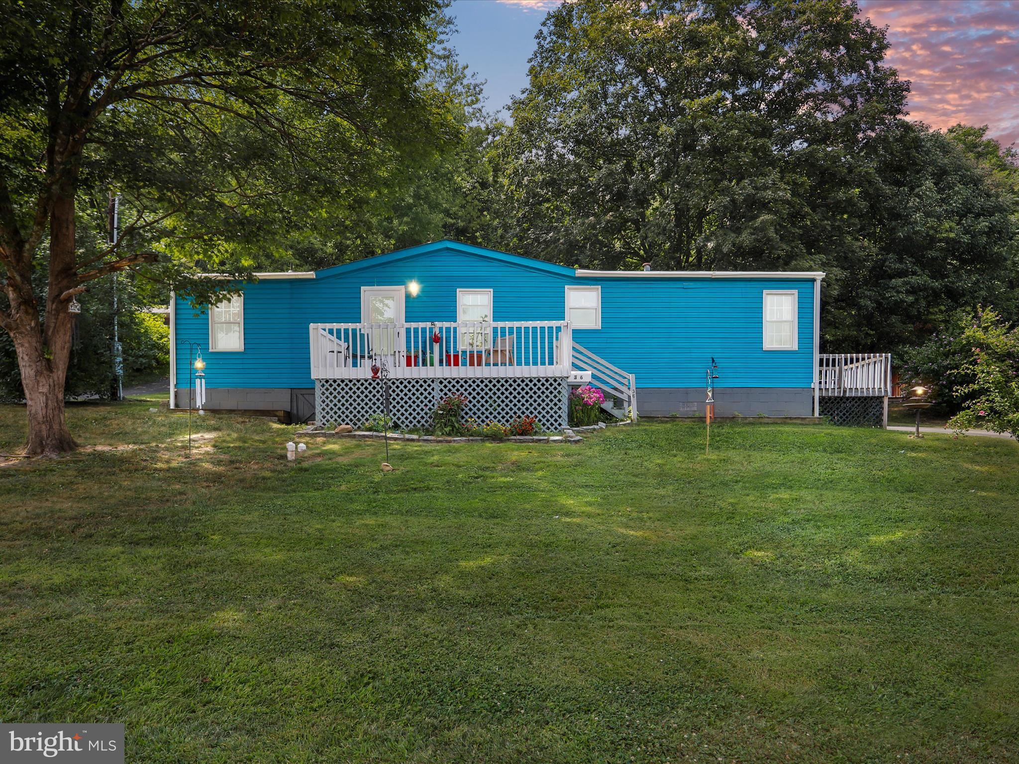 Move-In Ready 4BR/2BA Ranch-Style Home – Convenient Location!
Spacious and well-maintained doublewide ranch offering 4 bedrooms and 2 full bathrooms. Located near the high school and elementary schools with easy access to Rt 522—ideal for commuters or anyone looking to be close to town amenities in Berkeley Springs.
The home features a large living room with a wood-burning fireplace and sliding doors that open to a 30x17 cement patio—perfect for outdoor entertaining. The full kitchen includes newer appliances and a cozy breakfast area. The primary suite includes an attached full bath, with three additional bedrooms and a second full bath completing the layout.
Enjoy the privacy of a nice backyard with a firepit, ideal for relaxing evenings. Enter from the paved driveway onto a welcoming 8x8 side deck. Take in the Friday night lights from the front porch as you enjoy local football games.
This home qualifies for FHA financing. Ask if you’d like lender recommendations.
It has so much to offer and is move-in ready!