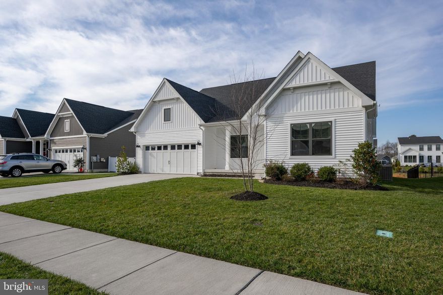 Welcome to 26230 Legacy Lane, a stunning 2022 built Savannah model that combines modern luxury with warm coastal-farmhouse character. Located in the highly desired community of Ocean Meadows in Lewes, this home is packed with thoughtful upgrades and offers the perfect blend of elegance, comfort, and functionality.
Step inside to a freshly painted home, bright, airy open-concept layout anchored by rich wood floors, upgraded lighting, and refined tray ceilings that elevate the home’s coastal style. The heart of the home is the gourmet kitchen, showcasing quartz countertops throughout, a spacious island, stainless steel appliances, and cabinetry that ties beautifully into the home’s fresh, beach-inspired palette.
Designed for convenience, the first-floor owner’s suite features a serene retreat with a spa-like bath and two generous walk-in closets. Two additional first-floor bedrooms provide versatility for guests, there is also a flex room that can be used as an office, music/reading or hobby space.
A standout feature of this home is the expanded second floor, offering a full fourth bedroom, full bathroom, additional living area, making it the perfect private getaway for guests, multi-generational living, or a second entertainment zone. 
Outside, enjoy peaceful mornings and evenings on your covered porch or patio, surrounded by the quiet charm of Ocean Meadows—a beautifully maintained community just minutes from Lewes’ beaches, dining, bike trails, and shopping.