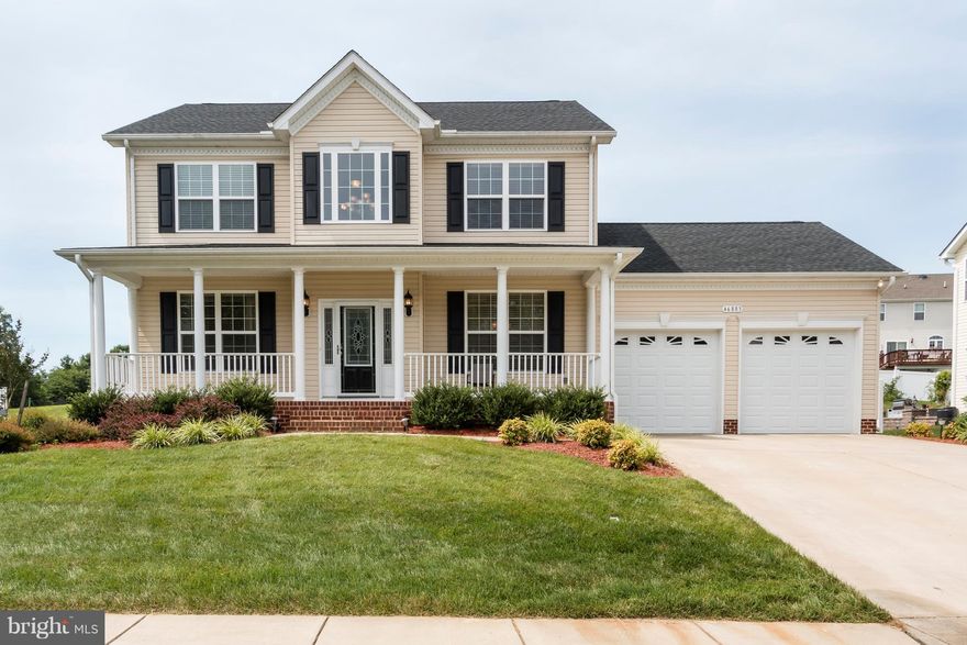 Perfectly maintained 4 bedroom home, hardwood throughout 1st & 2nd floors. Kitchen has 42 inch maple cabinets, granite C/T, gas cooktop, wall oven. Large master suite with extra large upgraded master bath with separate vanities, soaking tub, and full shower. Basement has full theater room with S/S, extra bed and full bath. Fully fenced in rear yard with patio and lawn sprinkler system. Move in now