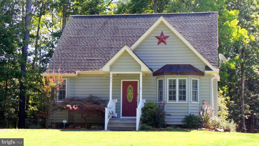 *Solomons unique opportunity to own a home in a small retirement community with public water and sewer and pay NO HOA's !! The only one requirement needed is at least one family member residing in the home and named on the deed be at least 55 yrs or older.  Enjoy peaceful living with only three other homes on quiet Cul-da-sac!  This quaint open floor plan offers Hard Wood Flooring through out home, 3 Bedrooms, 2 Full baths, a beautiful open kitchen with Cherry Cabinets,  granite counters, a matching kitchen island, dining area with entry to back deck. The living room off the kitchen has a Gas Fireplace with mantle and a front Bay window. Enjoy peaceful mornings on the front porch with treed view or quiet evenings on the private back deck... surrounded by trees as well (plenty of wild life to see) .  Master Bedroom and Full Bath on  main level !! This very quaint home offers an open floor plan with  comfortable living space inside and out.  Easily maintained yard so you have more time for you!!  The second level offers 2 Bedrooms and Full Bath. The basement has plenty of storage space, rough in for bathroom and 2 sump pumps. Back Creek Woods is Located in unique 55 plus waterfront community and is  close to shopping, urgent care, doctors offices, fire department,  AnnMarie Sculpture Garden & Arts Center is located across the street , The Hermitige Assisted Living and Solomons Town Center Park. Not far from Solomons Island and restaurants, Marinas, Chesapeake Bay, Patuxent River & many large Creeks.. .so no need to give up your privacy and still live in a wonderful area with so much to do!