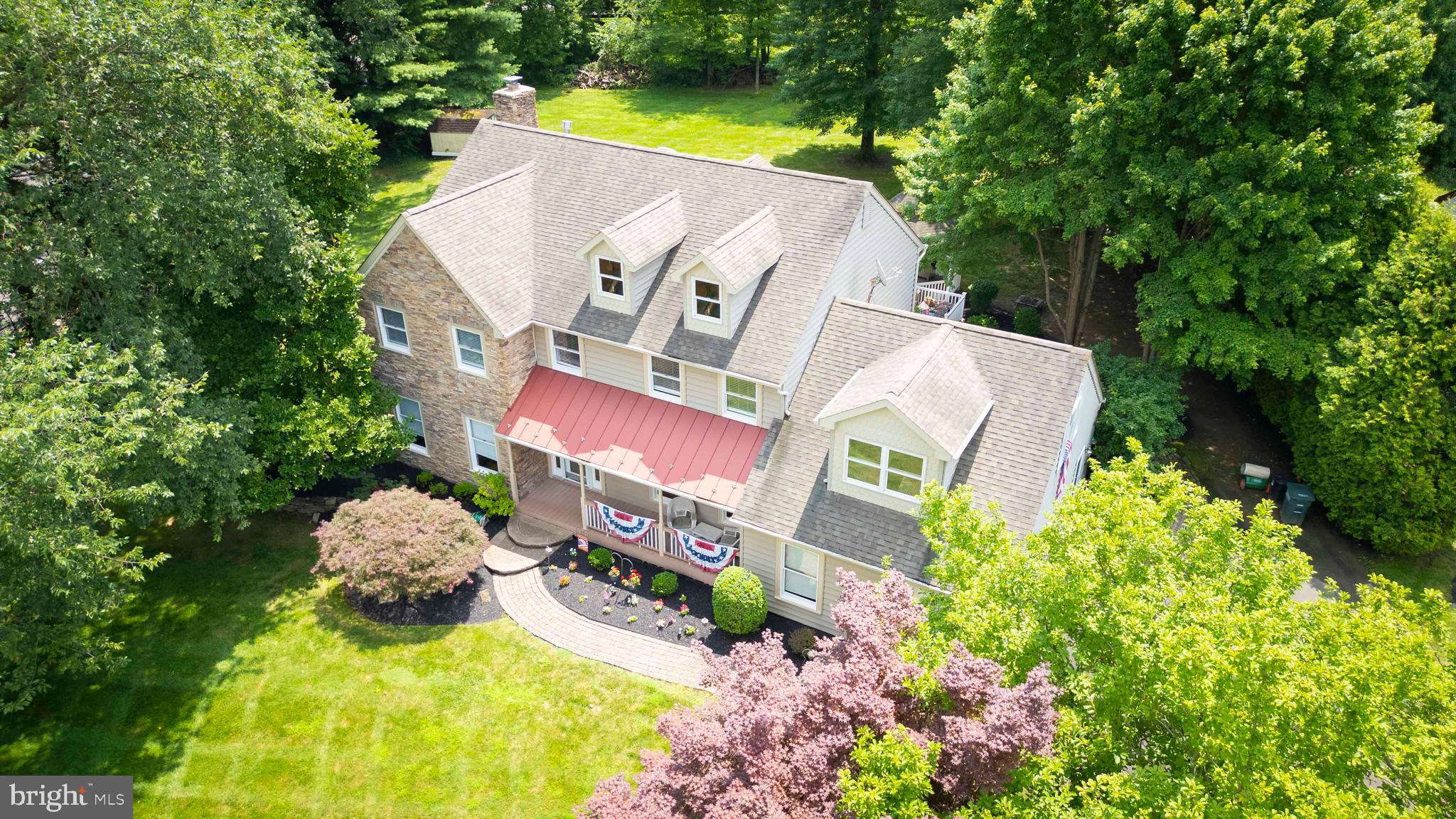 Totally remodeled - both inside and out including stone front, siding, roof, pavers, deck, gazebo, kitchen, all bathrooms and great room addition! This home is located in a cul-de-sac of custom homes which backs up to open space. Power failure concerns? Not this one - WHOLE HOUSE GENERAC GENERATOR!!! As you enter this magnificent home you walk past flowers and a covered porch. The entrance foyer is flanked by a formal dining room and large living room. There is a large eat in kitchen with 42 inch cabinets, granite counter tops and porcelain floors, free standing island plus separate eating area opening to the massive rear deck and gazebo with in wall speakers. The kitchen overlooks the Family Room with brick fireplace and wood burning insert as well as striking Brazilian Tigerwood hardwood floors flowing into the Great room addition which includes six skylights, sliding glass door to the deck, and an array of custom built windows viewing the backyard as well as a gas fireplace. This room is spectacular with its vaulted ceiling and sunlight forever! Close to the kitchen is the laundry room, entrance to the garage, an office with full wall of windows, powder room and the side entrance door.
The second floor is viewed through a two story entrance foyer and contains 4 large bedrooms, a sitting room/office/exercise room off the master which contains a skylight and a burst of triple windows, two large closets (One is walk-in) and two impressive baths of which one bath contains the standard tub with shower and a separate shower. The other bath is drenched in sunlight through the large skylight. and has marble floors.
There is a full basement which is partially finished with ceramic floor and a full bath.
The exterior has paver walkways, extra large deck , and separate gazebo with access to the open rear yard. This scant 4,000 square foot home is a one of a kind home which has been lovingly cared for and upgraded by the current owner. The owners are Licensed Realtors.