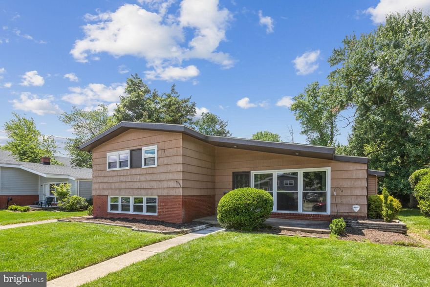 Accepting Backup Offers…Embrace the iconic mid-century modern living in this stunning Valley Stream gem! Flooded with natural light from new, energy-efficient LowE windows, this home boasts gleaming, rejuvenated hardwood floors throughout the main and upper levels. The lower level offers the perfect entertaining space with stylish new LVP flooring. Step outside to your expansive backyard oasis, complete with a large shed for all your storage needs. Fire up summer barbecues with ease thanks to the plumbed-in Weber gas grill, the envy of all your guests and never have an empty propane tank again. Inside, the updated kitchen features ample sleek granite countertops and a large dining room- perfect for large gatherings. The bonus space off of the dining room will make for a great home office, play room, or 2nd kitchen "to-be". Fresh paint throughout adds a touch of modern elegance, while the classic cedar shake shingles on the exterior lend a timeless charm. The large flat lot makes this home ideal for expansion! Peace of mind comes with a 6-year-old roof boasting a 50-year warranty – one less thing to worry about! Don't miss your chance to make this well maintained  home your's.