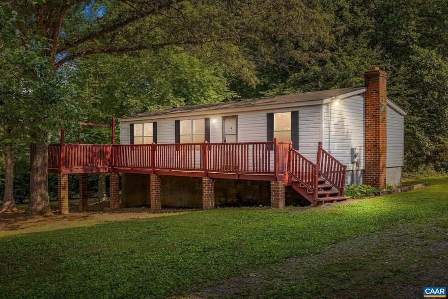 Peace and privacy abounds with this manufactured home situated on 3.68 acres! Offering 3 bedrooms and two full baths, an open kitchen and living area, primary suite with attached bathroom, and a full unfinished basement for future expansion! The large front deck is perfect for nature watching or relaxing with your morning coffee. Whole house water filter system. Detached 20x20 building with electric for your vehicle, mower, atv, or to create the perfect man cave or she-shed! Property is fully fenced with a garden space, mature hardwoods, and additional sheds for storage. Playset conveys!,Formica Counter,Wood Cabinets,Fireplace in Basement