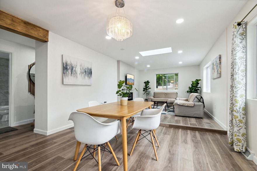 Seller is reviewing all offer Sunday 6pm.  Are you looking for a newly renovated home with a low interest rate? This is your chance to own this beautiful home that comes with a complete accessory dwelling unit that you can rent out to offset your mortgage!  Welcome to this charming light filled  contemporary 4-bedroom, 2-bathroom home on a spacious private lot. The home has been fully renovated from top to bottom.    Offering total sqft finished of over 2100 which includes the detached finished ADU.  The ADU offers an efficiency unit with a bathroom and kitchenette as well as a separate heating and A/C.  The owners didn’t leave a brick unturned to transform the house into a contemporary, modern design that combines nature and style. Essentially a new home featuring * Brand new roof * New windows and Skylights throughout the main level * Beautifully remodeled bathrooms with porcelain tile * 2 tone Kitchen cabinets *Quartz countertops* Samsung stainless steel appliances, washer & dryer * Contemporary electric fireplace * updated electric * Recessed LED lighting * Water resistant LVP flooring throughout the house * New custom painting inside and out * New heat/AC unit in the  Office/Studio/In-Law (ADU).* New main home HVAC 2023* New Water heater 2023* Renovation work was permitted and all inspections were completed by Montgomery county. 

Once you step into the house, you will be welcomed with an open-concept layout that effortlessly connects the kitchen, dining space and living room. The warmth of the natural light entering the room from the large windows and skylights will make you feel right at home. The beautiful upper-level primary bedroom features custom decorative paneling, designer light fixtures, and a very nice walk-in closet. The lower level boasts three good size bedrooms with large closets, full size windows and a beautifully renovated full bathroom also with custom finishes. The house is nicely tucked away from the street bringing lot's of privacy. It features a long driveway that can fit as many cars as you and your guests need so you do not have to worry about parking.  An expanded front yard that leaves plenty of space for kids to run and play or a nice place for your garden as this front yard gets a ton of sun! Live off the land this would be a great place to grow all of your vegetables. A fully fenced backyard that backs up to mature trees offers a nice mix of entertainment and tranquility. The backyard also offers a nice place for the kids to play in the fenced yard while the family and friends relax on the deck.  Whether you are having a barbecue or gathering around a pit fire with your loved ones, or just relax to enjoy hearing the birds sing, this is a yard you will truly enjoy!  There is also a good sized shed for storage of all your outdoor tools. 

Facing south allows for tons of natural light.  The future home owner should consider going solar, take advantage of the ample sunlight and save on energy bill.  What a unique opportunity with a bonus accessory dwelling unit (ADU) with the potential that it can be used as a home office/studio/gym/In-law/rental.  The house is conveniently located just off New Hampshire Ave, close to the FDA, shopping centers, restaurants, walking trails, swimming pools, Brookside Gardens, schools, and commuter routes. The house PLUS the bonus accessory dwelling unit (ADU) is over 2100 sqft of living space. The public records have the wrong sqft. 

Don't miss seeing this one . . . You will know you are home once you step foot inside and feel the warmth of this newly renovated home. Do not allow this one to slip by because it truly is HOME!