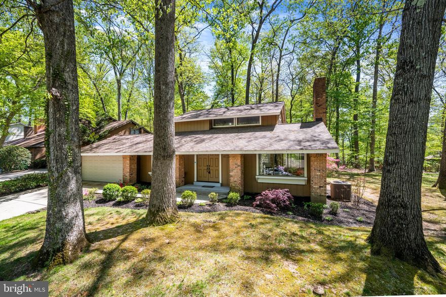 Retro Vibes, Modern Potential: The MCM Gem You’ve Been Waiting For If you’ve been scrolling for a home with actual personality, stop right here. This Mid-Century Modern (MCM) standout is the ultimate "main character" house. Owned and meticulously loved by the original owner, it’s a rare, clean slate that’s been perfectly preserved and is now ready for its next chapter. The Aesthetic: This isn't a cookie-cutter renovation; it’s an authentic vibe. We’re talking classic high vaulted ceilings with exposed wood beams that make the main floor feel airy and expansive, and the iconic sunken lounge is a total mood setter. Whether you keep the vintage green carpet for the aesthetic or swap it for your own style, the architectural "drop" is pure MCM cool. Head downstairs to the ultimate entertaining hub and your classic 1960s/70s-style basement bar, complete with original wood paneling, perfect for hosting retro parties. Large windows bring the greenery inside, leading out to a peaceful patio and a flat and fun backyard that back directly to Columbia’s legendary trail system. This home your canvas and is exceptionally well-maintained. It’s the perfect mix of funky vintage details and a layout that totally works for modern life. Don't settle for basic. Come see why this original-owner treasure is the most unique opportunity in Columbia right now.