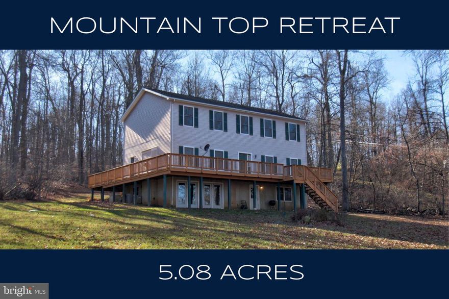 Surrounded by more than 5 acres of peaceful, wooded land, this home offers a truly serene mountain setting. Mature trees, a wide grassy yard, and an elevated location create a calm, private retreat where wildlife is part of the daily experience—squirrels and chipmunks play among the trees, and turkeys can often be heard calling in the distance. Sky Meadows State Park and the Appalachian Trail are just moments away.

The main level includes a spacious family room with a propane fireplace and access to the wrap-around deck, providing an easy connection to the outdoors. A bright, spacious kitchen provides generous counter space and storage, along with formal living and dining rooms, offers comfortable everyday living.

Upstairs includes an oversized primary suite with ensuite bath and walk-in closet, plus three large additional bedrooms, a full bath, and a convenient upper-level laundry room.

The lower level offers a finished full bath with walk-in shower and an unfinished recreation area with French door walkouts—ready for future customization. A 2-car side-load garage and whole-house generator add practical convenience.  High Speed Xfinity Cable Internet and no HOA!

With 4 bedrooms upstairs, 2 full baths, 2 half baths, and an extraordinary natural setting, this property provides a rare opportunity to live in true peace and quiet, surrounded by the beauty of nature.