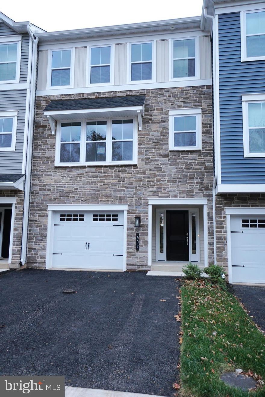 Looking for New Construction but not ready to buy yet? Welcome to this stunning Brand New 3 bed, 2.5 bath Townhouse that offer the perfect blend of style and functionality. The open-concept layout highlights a modern kitchen featuring an island and pantry along with with a second row of cabinets, perfect for a coffee station and additional counterspace. Upstairs, the primary suite retreat features a vaulted ceiling, walk-in closet, and an elegant ensuite with dual sinks and a spacious shower. Plus, enjoy the convenience and ease of a second-floor laundry room.  The finished lower level with walkout access provides flexible space for work or play, while the second-floor Trex deck is perfect for outdoor gatherings; both of which adds valuable living  and entertaining space.  This home comes with a one-car garage with a brandy new Epoxy covered floor, an asphalt driveway, and plenty of extra parking.  All of this is just minutes from Montgomeryville shopping, Assi Market, and Jefferson Lansdale Hospital.