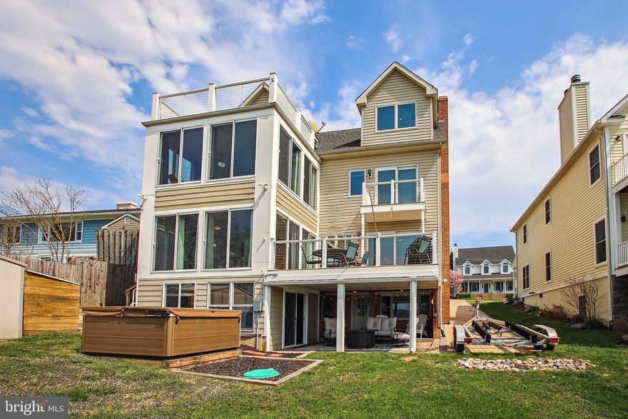 Welcome Home to this beautiful waterfront property on highly sought after Turkey Point Island. Amazing views and sunsets are awaiting from almost every room in this home and from your private 225' lighted pier that includes three boat lifts (including 20,000lb and 12,000lb lifts), two jet ski lifts and water and electric hookups.  Come off the water after a day of boating and enjoy entertaining guests in your private tiki bar and covered patio. This stunning resort-style living 5-bedroom, 4.5-bathroom home has four levels of living space with breathtaking views of Selby Bay. The main floor of the house consists of an open concept kitchen, dining room and great room that lead to a beautiful sunroom and open sundeck. It is a perfect location for grilling and enjoying the evening air. The primary suite with its own sunroom, on-suite and walk in closet are a perfect retreat after a long day. The newly remodeled on-suite includes a walk-in shower, a large tub, double vanities and heated ceramic floors. Two additional bedrooms and a full bathroom are located adjacent to the primary on the third floor. The fourth and top floor of the home has an open bedroom that is currently being used as a family room, an office and a workout room combined. The room opens to an outstanding sundeck with spectacular views of the bay. This floor has a full bathroom that includes the washer and dryer for the home. The lower level of the home consists of the 5th bedroom, a full bathroom and a separate living room space with a private entrance to the backyard. This floor would be perfect for an older teenager or mother-in-law. Storage for the home is on the lower level and includes a second washer/dryer hookup. The newly paved driveway and additional parking pad provide plenty of parking. Don't miss out on this beautiful home and a chance to own a piece of paradise on Turkey Point Island!