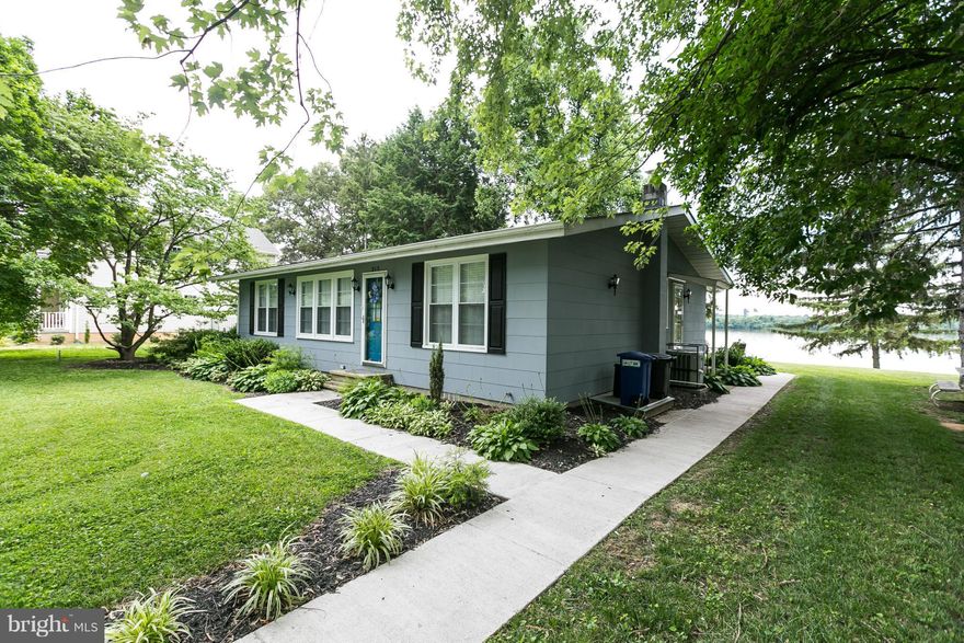 Enjoy this wonderfully updated waterfront rancher on 1/2 acre!! Over 1500sf of open relaxation. HUGE sunroom addition overlooking the water, gleaming hardwood floors, new granite eat-in Kit with waterviews! Designer baths & finishes! Enjoy entertaining on rear patio! All this plus 2-car detached garage! All appliances and systems 2 years old.