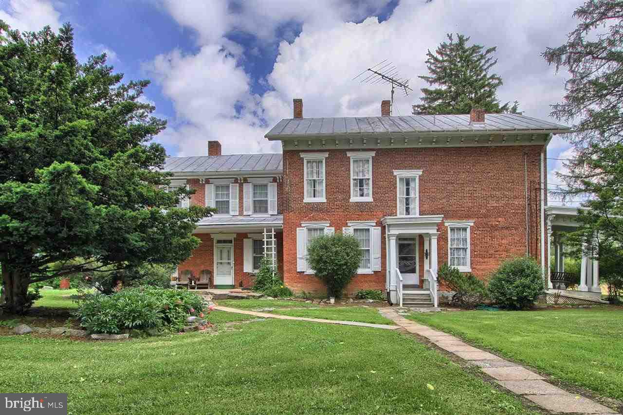 Do not miss this charming all brick early 1800 farm house built w/ the quality & attention to detail of that era. Home features 6 BRS, 3.5 baths.  Spacious 3280 sqft home w/ 10? ceilings.  Kitchen opens up to a sitting room w/ fire place.  Laundry hookup on 2nd floor. Property has large traditional bank barn on 8.6 lovely acres. Ideal for horses, gardening, fruit trees. Located approximately 7 miles west of Carlisle.