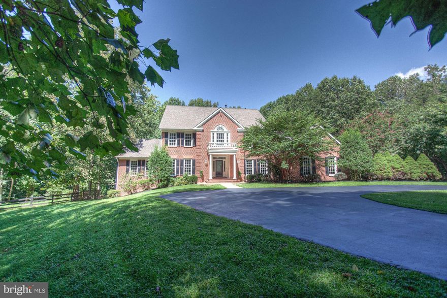 Tucked away on four private acres, this resort-like estate offers nearly every amenity the mind can imagine.  With over 8,000 square-feet (est.) on three elevator-serviced levels, the interiors are enhanced with an open main-level floorplan and generously proportioned rooms throughout.  The sellers have tastefully invested more than $500k in improvements, both inside and out.  Upon entry, you will marvel at the vastness of the property from the grand foyer, with formal living area on the left and dining on the right, all with newly refinished hardwood floors.  The eye is immediately drawn to the great room towards the rear of the house, anchored with a wood-burning fireplace and walls of windows ushering floods of natural light.  The kitchen, open to the great room, features a considerable breakfast area, high-end appliance suite, pantries, and direct access to the formal dining room via butler's pantry with a wet bar.  Also on the main level is a study, enclosed with glass French-doors and direct access to the rear deck, a main-level bedroom with en-suite full-bath, and access to the 3-car garage which has been upgraded with organizational systems and epoxy flooring. Upstairs, the bedroom level showcases our grand owner's suite, with sitting room, an enormous walk-in closet, updated bath with contemporary soaking tub and separate shower.  The primary guest suite has soaring cathedral ceilings and en-suite bath that can be confused with a master-bath due to it's generous size.  Two other secondary bedrooms are connected via a Jack & Jill bath, and the upper level is completed with a bedroom-sized laundry room.  The lower-level experience in this home is an entertainers dream.  In addition to open recreation spaces, the other areas have been fully remodeled.  The pub/bar room features upgraded flooring, a stone archway, full refrigerator, dishwasher and stone countertops.  The fitness center offers rubber flooring, mounted flat-screens, a mirrored wall and dry sauna.  Also on the lower-level is a cinema, outfitted with high-end projection, upgraded silver-screen, and tiered seating, all which convey.  The lower-level is completed with ample storage space, as well as a guest bedroom with a full-bath that can also double as the pool bath.The exterior grounds of this estate are magical.  Extensively landscaped, the property offers abundant open spaces while maintaining a supremely private environment provided by mature trees in every direction.  The pool, with hardscape stone plaza, features a raised spa that has waterfalls that cascade into the water below.  Adjacent to the pool is the outdoor entertainment pavilion, complete with outdoor kitchen, strong wi-fi service, a handsome stone wood-burning fireplace, and wiring for televisions.  This property is just minutes from major lifestyle attractions, including: the Wolf Trap National Park for the Performing Arts, the thriving commercial hub of Tysons, the dining & shopping destinations at Reston Town Center (with nearby Metro access), and quick commutes to Dulles International Airport, and downtown Washington.  For the adventurous minded, directly connected to this property is cross country paths, biking & hiking trails, and close proximity to the W&OD trail.  This magnificent oasis awaits you, 1428 Crowell is now available.