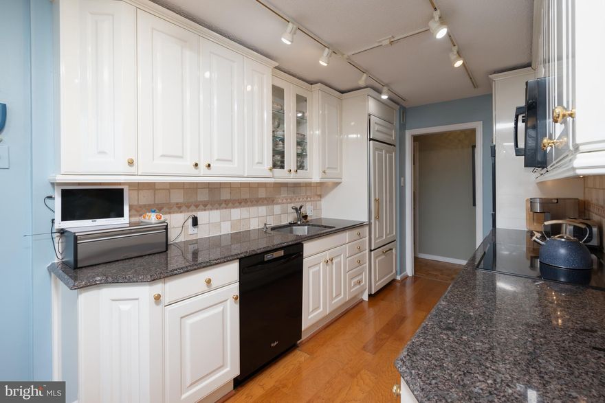 Highly Coveted Corner Condo In Beautiful  Briar House .  This Extremely Spacious 2 Bedroom, 2 Bath Unit Boasts Wood Flooring Throughout,  A Fabulous Updated Eat- In Kitchen , And The Convenience Of The In-Unit Washer And Dryer.  Enjoy The Abundance of Natural Light As Well As A Plethora of Storage.  From Built-In Shelving To Plentiful Closets To A Separate Storage Area Down The Hall. The Moment You Step Into The Foyer It Feels Like Home . The Generous Living and Dining Space Offers Room For Multiple Seating Areas And Can Accommodate Large Dinner Parties And Family Gatherings.  Both Bedrooms Are Generously Sized With  The Primary Bedroom Featuring En Suite Bathroom and Enormous Walk In Closet. This Condo is Situated in The A Wing Of The Complex Which Is the Farthest From The Street, Creating a Peaceful and Private Atmosphere With Only One Shared Wall and A Large Balcony Overlooking Wooded Greenspace.  Briar House Features A Renovated Lobby , Dual Elevators, Community Room, a 24/7 Doorperson , Helpful Staff Handling  Everything From Groceries To Package Delivery. The  Hoa Includes Pool Access And Gated Garage Parking . Conveniently located to shops, restaurants, parks , quaint downtown Jenkintown and 2 train stations .