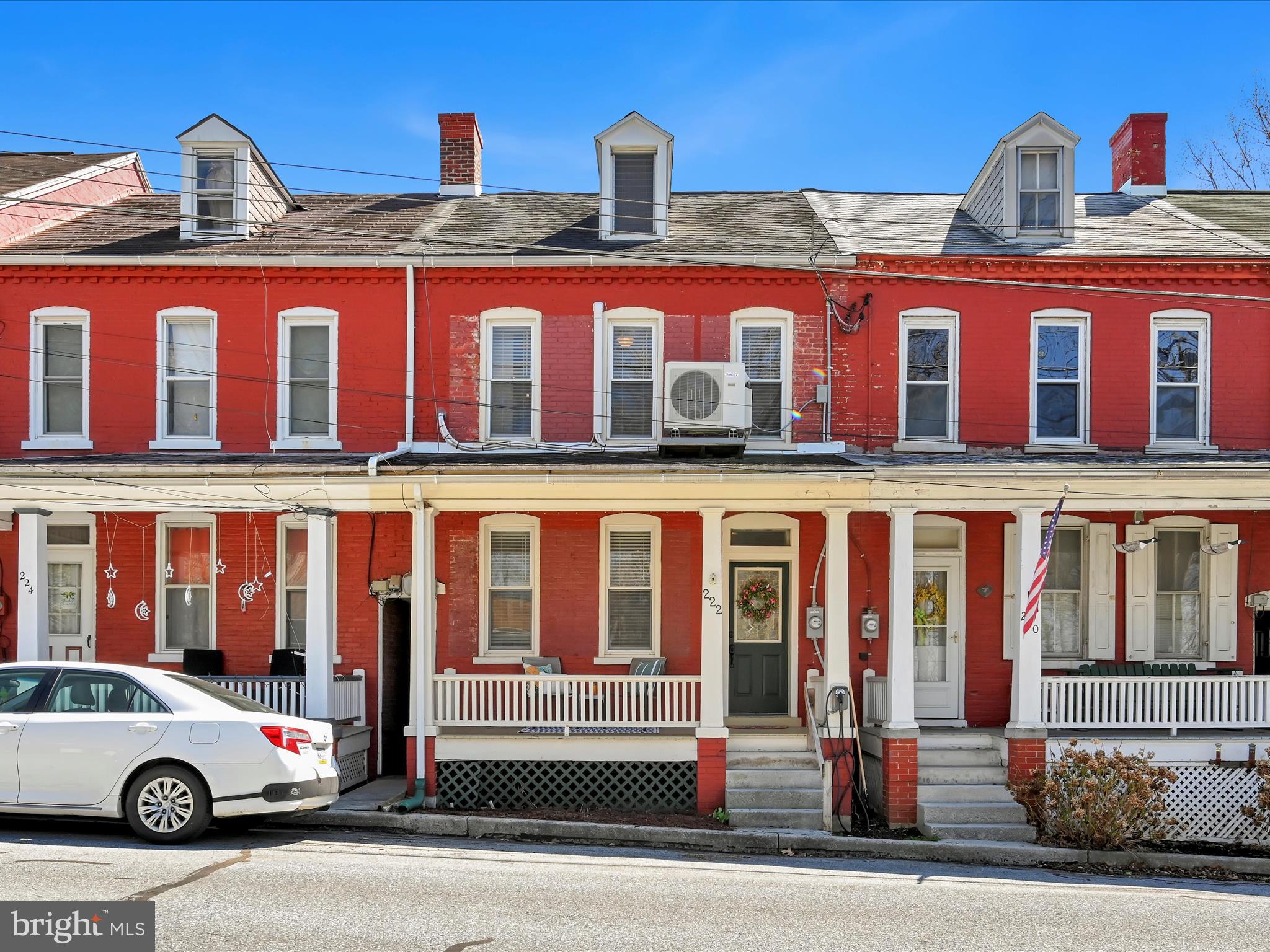 Check out this beautiful, remodeled 3 story townhouse in Rexmont's Brick Row. This home is light and bright and ready for new owners! The main living space offers a cozy living room and a bonus room which is currently used as an office. The spacious lower level kitchen boasts tile backsplash, new countertops, wood laminate floors and stainless steel appliances. The dining area features a cathedral ceiling and skylight. There is a half-bath closet (toilet only) and a large mechanical/laundry room with additional storage on this level. The 3rd floor offers two sizable bedrooms and an upgraded bathroom. The attic space is large and unfinished and could serve multiple uses. This home has off-street parking, and a lovely fenced back yard with a shed and patio area. Current owners made some great improvements including mini-splits for AC. This home has so much charm and character- you must see it! Located in a rural setting (you can walk to the rail trail!), but close enough to Lebanon, Lancaster, Hershey, and the turnpike. Seller will leave car charger out front (as is) if the buyer has use for it. If not, the seller will remove.