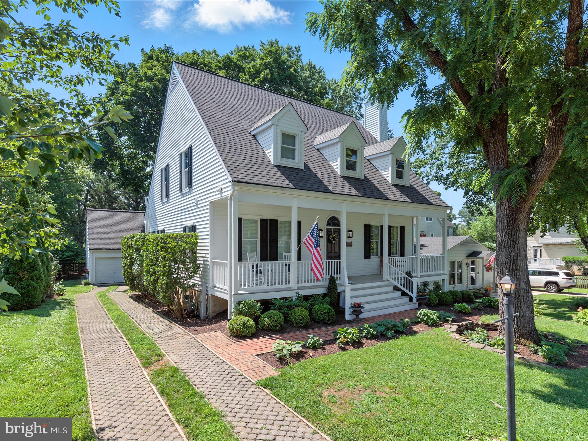 Stylish and cosmopolitan architectural design property in highly sought after West Annapolis, sited on a large, manicured, landscaped 9,000 sq ft lot, with a convenient and functional one car detached garage with lots of overhead additional storage and brick driveway. This five bedroom, three full and one half bath Cape Cod, boasts over 3,900 of finished square feet on three beautifully appointed levels. This near shore trendy dream home boasts contiguous, brilliant hardwood floors on the main level featuring a newly renovated, elegant chef's dream eat in white kitchen, with center island, marble countertops, upgraded stainless steel appliances, (including a 5 gas burner oven range,) upgraded Double Kohler sinks and faucet, water dispenser and remote control blinds. A light filled dramatic, vaulted, cozy living room with wood burning fireplace, hand carved mantel, encased with Anderson Oversized windows transitions you from the entrance foyer to the gourmet kitchen. The main level primary owner's suite showcases a gas fireplace, French doors, colossal walk-in closet, new freestanding tub, marble counters, frameless glass enclosure, and an access door to the rear deck. The updated powder room bath rounds out the main level.. A lovely hardwood staircase ushers you to the hardwood second story landing and catwalk featuring Three generous size bedrooms with a pretty water view and updated full hallway bath with skylight. The recently finished large, bright lower level comprises LVP flooring, high ceilings, 3 windows, and includes a 5th LEGAL above ground bedroom with closets and LVP flooring, a finished family room and kitchenette area with built in cabinets, wine rack, refrigerator and microwave, a large full bathroom with a sophisticated herringbone design marble floor, marble vanity sink and full marble walled shower. A large storage room with outside rear access and another secondary storage area completes the fabulous lower level. A welcoming, full length front porch, provides outdoor engagement opportunities with your neighbors. screened-in porch for shade ( accessible from the kitchen) and additional open deck for grilling and sunbathing. Great rear yard with decorative pergola, perfect for entertaining and the children to play.
Recent updates include: ( Brand new June 2025 Architectural Shingle Roof on house and garage -$19,900 ), (New HVAC with 2 zones 2021- $13,886), ( Finished Lower Level -2021- adding family room, 5th Bedroom, full bath and kitchenette -$72,745) Full upgrade to rear deck and painting -2025- $10,150) (Painting of front entry stairs, living room and vaulted ceilings -2025- $5,795) - too many others to list here - check documents tab and List of Updates Flyer in the kitchen.
(Premier West Annapolis street right across from Weems Creek and just 1 block away from water access at the end of Tucker St. Convenient to West Annapolis restaurants and shops and just a brief ride to City Dock and ideal location to Route 50 for all commuter routes.