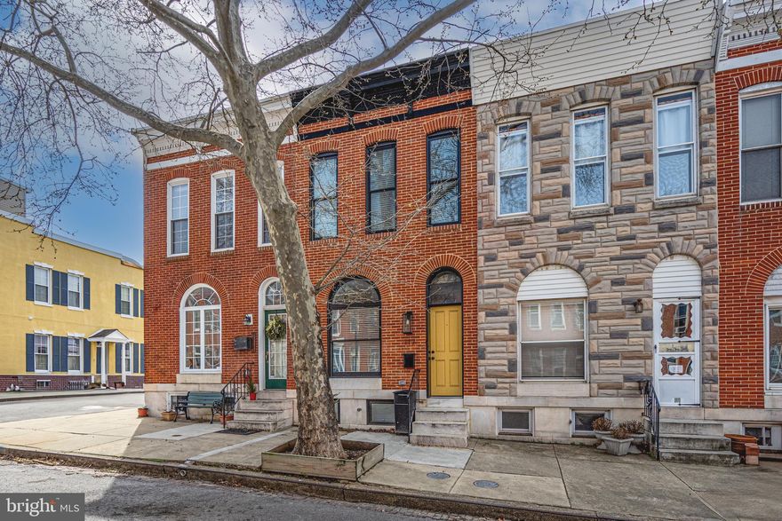 Come explore a previous Building Character CHAP renovation right in the heart of Federal Hill! This 14-foot wide home offers over +2,100 finished square feet of finished living space and includes the rare convenience of private parking. The main level showcases 9-foot coffered ceilings, upgraded trim details, and a beautiful kitchen featuring a 6-foot waterfall island, custom cabinetry, stainless steel appliances including a beverage fridge, high-end countertops, and plenty of space for a full dining table.

Upstairs, the primary bedroom includes a walk-in closet and a luxurious spa-style bathroom with dual vanities. A second spacious bedroom also features its own full bath with a sleek, modern shower. The roof deck, accessed through a true center hallway, offers sweeping views of the skyline and stadium—perfect for entertaining or relaxing.

The finished basement includes two more rooms and both a full and half bath—great for guests, an office, or a home gym as currently used. Additional features include whole-house audio, premium tile work, detailed trim, designer paint, and a top-tier appliance package.

This home also benefits from the Baltimore City CHAP Historic Tax Credit, which keeps property taxes significantly reduced through 2029—offering major monthly savings and thousands more over the next  approximate  5 years. Close by to Cross Street Market, local shops, restaurants, and Riverside Park, this home offers easy walkability to everything Federal Hill has to offer. Don’t miss this rare chance to own a fully upgraded, tax-advantaged home in one of Baltimore’s most desirable neighborhoods!
