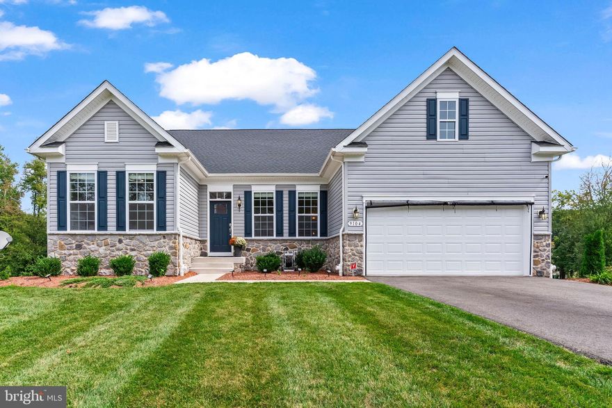 This nearly new home offers true one-level living with no stairs on an almost half-acre lot. Inside, you’ll find a dedicated office on the main level, perfect for working from home. The gourmet kitchen features a double oven, stainless steel appliances, 42-inch cabinets, quartz countertops, and an open layout ideal for entertaining.
Enjoy hardwood floors throughout the main level and relax in the spacious family room with a cozy fireplace. The finished basement adds even more living space with a bedroom and full bath, a large recreation area, and room to customize for your needs. A 2-car garage completes this modern, move-in ready home built for comfort and style.