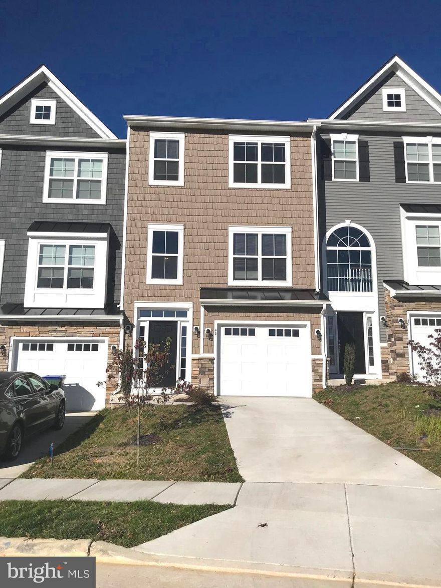 Heather Hills - Like new luxury 3 level townhome with 3 bedrooms, 2 full and 2 half baths.  Features wood floors, 1 car garage, fireplace, 9 foot ceilings, recessed lights and much more! Gourmet kitchen with stainless steel appliances, island and granite counters.  Convenient location close to I-95 and Leeland Train Station. Pets are considered case by case. Available 3/31/25.