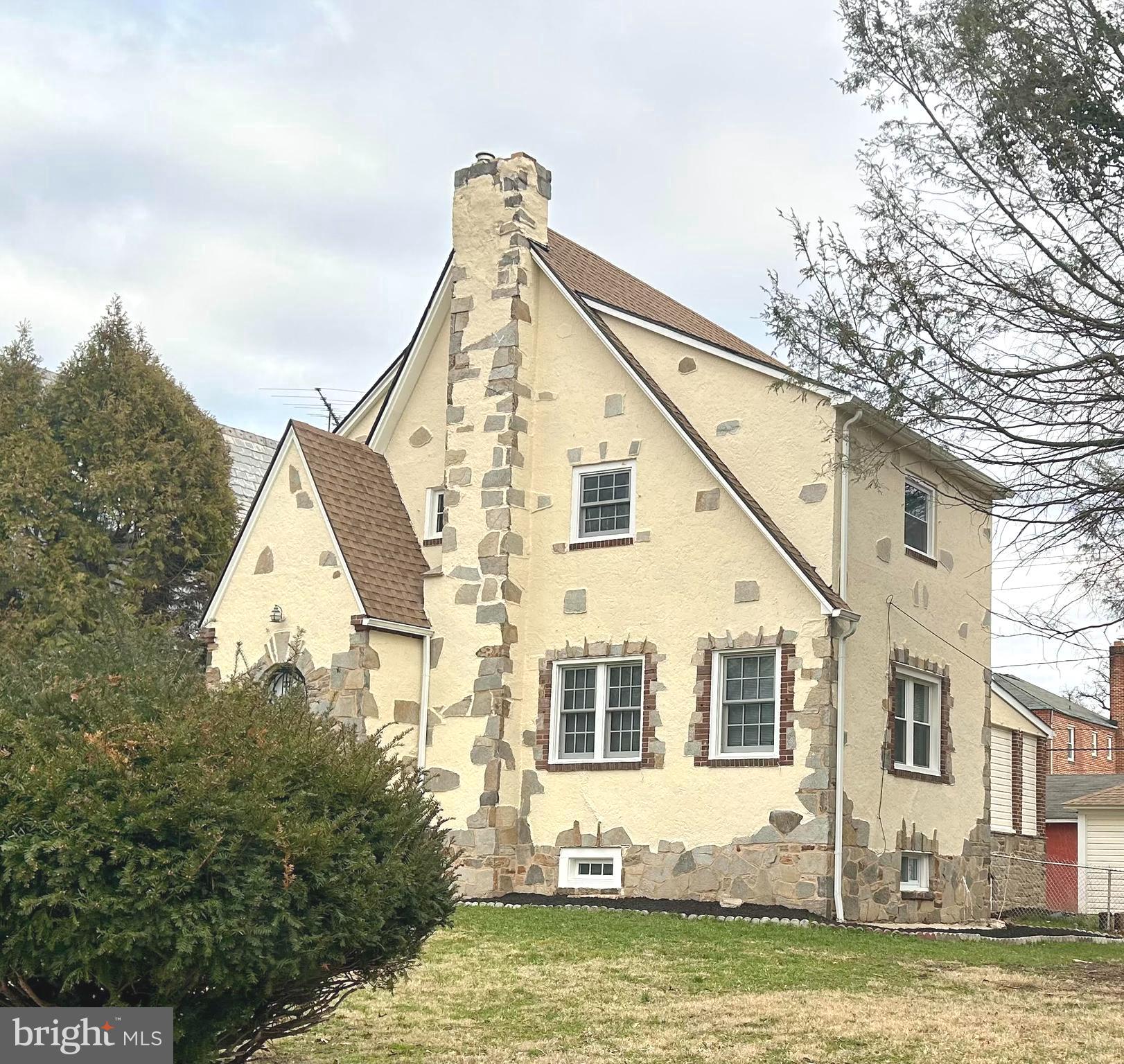 Welcome to 3405 Dennlyn Road, in beautiful Baltimore Maryland! This home is located in the Baltimore City, MD Historic District and is situated in the charming community of Ashburton, This totally attractive, Tudor Style home, has recently been updated. Enjoy the historic feel of a 1930's city home, with all of today's trending appointments inside. This lovely home features brand new windows, two original fireplaces, two flex rooms in the lower level, a finished lower level family room, gas heat, CAC, brand new flooring, arched entryways, formal dining room, granite counter tops, ceramic bath tile surrounds, 6 burner (gas) Dacor stainless steel stove, other stainless steel appliances, dual coat closets in the foyer, beautiful hardwood staircases, owners bedroom with private bath, recessed lighting, new roof, 1 car garage, an outbuilding that would lend well to an outdoor mancave or she shed with brick tile flooring, flagstone flower beds welcome you in the driveway, digital locks, security system, enclosed rear porch , cedar walk in closet in the attic level bedroom and the list goes on! Minutes from the Inner Harbor, Ravens Stadium, Camden Yards, downtown restaurants, shopping and convenient to I-83. Pack your bags and move right in!