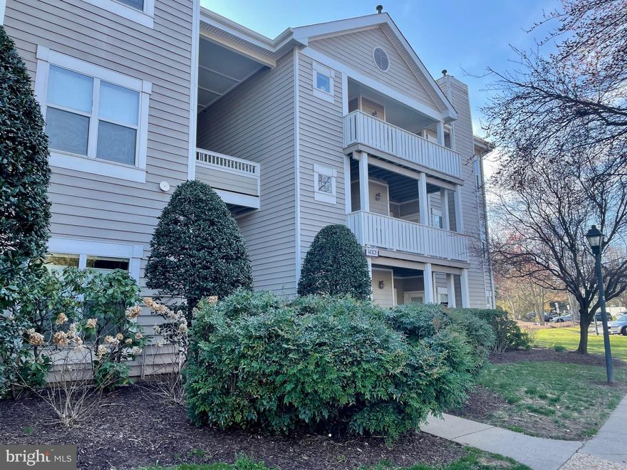 Rarely available, this first-floor condo is one of the largest in the community and has been stunningly and thoughtfully renovated from top to bottom. The open-concept floor plan and distinct living spaces set this unit apart. You'll enjoy beautiful high-end finishes throughout the unit, including 12mm woodgrain porcelain floors (no carpet in the unit!), a fully equipped gourmet kitchen with white cabinets, off-white marble countertops, a 5-burner gas stove, stainless steel appliances, white ceramic wall tile, polished floor tile, and much more. Please see the list of recent updates attached. 

You will enjoy the fully remodeled two full baths with Spanish hand-made ceramic wall tile, Bedrosians Stone Valley porcelain floor tile, a floating vanity in black walnut finish, a beautiful soaking tub, a shower with a Tropical system, and more. This smart home features Phillips Hue Smart lights ( you can control them with your phone), a highly efficient smart Wi-Fi Washer/Dryer with Steam and 6 Motion Technology, and a Nest thermostat. Recently painted  (walls, ceiling, doors, trim, baseboard), and many other recent finishes/upgrades were installed.  
In addition, the living room has a gas fireplace for cozy nights, and there is a serene private terrace where you can relax and unwind. The are 2 walk-in closets with built-in shelves, extra storage, one assigned parking spot, and plenty of visitor parking spaces. 
Community amenities include a lake with walking trails and a rec center with a pool, spa, gym, and indoor racquetball court. This urban location is within walking distance of the regional library, grocery stores, shopping centers, and many restaurants. Plus, there is easy access to I-66, 28, and 29 to get anywhere you need to go quickly. Check the video tour attached.