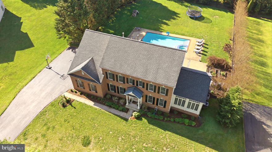 This gorgeous home located on nearly two-thirds of an acre is the best value in the prestigious golf community of Hampshire Greens. Its elegant foyer welcomes you to the main living areas. The home office is perfectly located at the front of the home, while the living room on the other side of the foyer flows into an amazing conservatory that can serve multiple purposes. With the dining room adjacent to the kitchen, these three rooms together create the perfect combination for entertaining. The gourmet kitchen has been updated with new appliances, including a Samsung Bespoke refrigerator and a Bosch dishwasher, along with quartz countertops and a porcelain farmer’s sink. Beautiful porcelain tile flooring extends through the kitchen, breakfast area, and family room. A sunroom located just behind the kitchen can also serve as an alternative breakfast area and flows beautifully to the backyard. New LVP flooring covers several additional areas.

As you ascend to the upper level, you will find the principal suite, which features a sitting area perfect for relaxing, reading, or a home gym, along with a large walk-in closet. The attached principal bath has been recently renovated with upgraded lighting and a new spa-style shower with wall jets and dual overhead rain heads. The upper level also includes three additional bedrooms, two of which are connected by a Jack-and-Jill bath, as well as another full bath dedicated to the fourth bedroom.

The fully finished lower level has been recently renovated and now includes a movie screening room and a one-bedroom apartment. The apartment features its own kitchenette and full bath, providing an ideal space for extended guests, in-laws, or even short-term tenants. The movie screening room is complete with a 4K projector and Dolby Atmos surround sound system. An additional room and full bath have also been added, offering even more versatility to this level. Walk-out stairs from the apartment provide access to the rear yard and also serve as a private entrance for the apartment resident.

A large patio stretches across the rear of the home, overlooking the serene in-ground pool, an ideal setting for entertaining or quiet poolside reading. The backyard is flat and completely fenced, making it perfect for soccer practice and outdoor gatherings. A smaller fenced-in area offers a great space for gardening and growing homemade vegetables with raised flowerbeds.

Hampshire Greens is a golf community located in Montgomery County, Maryland. Built between the 1990's to 2001, this community consists of 286 single family homes set atop large private half an acre or larger lots with state-of-the-art landscaping. Most of the homes are adjacent to the fairways and greens of the Golf Course with the serious golfer in mind. The community also includes amenities such as tennis courts, playgrounds, and picnic areas for its residents. This community has easy access to DC, Baltimore, Virginia, and Frederick with an easy drive to the area three main airports in the area.