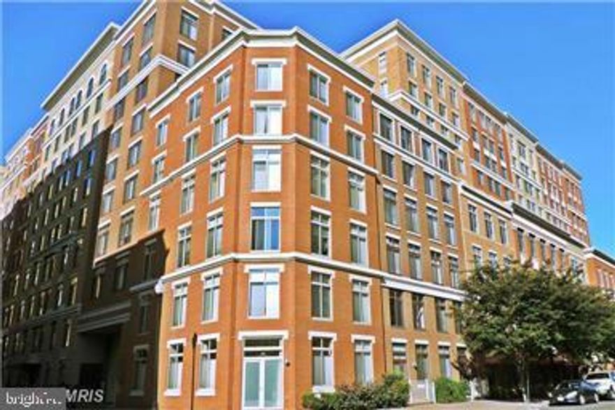 This stunning on bedroom, one bath is on the 8th floor in a fabulous building close to metro, Trader Joes, Shopping and restaurants.Open sunny and move in condition has a fire place, balcony and garage parking.Gleaming maple floors in the living/dining area and carpet in the bedroom.   Live in a luxury building with a pool and enjoy the city life at your door step!!