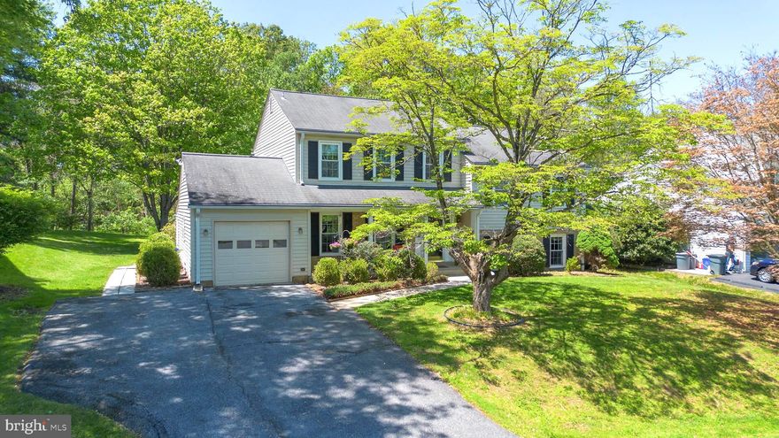 Nestled in the sought-after Brookeville Knolls community, this beautiful colonial with a garage offers the perfect blend of comfort, space, and timeless charm. Step inside to find a welcoming layout featuring a formal living room and elegant dining room, ideal for both everyday living and entertaining. The kitchen is equipped with granite countertops, stainless steel appliances, and a cozy breakfast nook perfect for morning coffee or casual meals. Just down the first flight of stairs, you’ll find a spacious family room centered around a warm fireplace, creating the perfect gathering space for relaxing evenings. This level also includes a full bathroom and convenient laundry area. The unfinished basement offers endless potential for future expansion, storage, or customization to fit your needs. Upstairs, the expansive primary suite serves as a private retreat with its own sitting area and en-suite bath. Three additional generously sized bedrooms and a hall bathroom provide plenty of room for family and guests. Enjoy the beauty of every season from the enclosed sunroom, a light-filled space perfect for enjoying peaceful spring days. Step outside to the beautiful backyard featuring a floating deck overlooking serene natural views, offering privacy and the perfect setting for outdoor entertaining. A charming front porch completes the home’s inviting curb appeal.