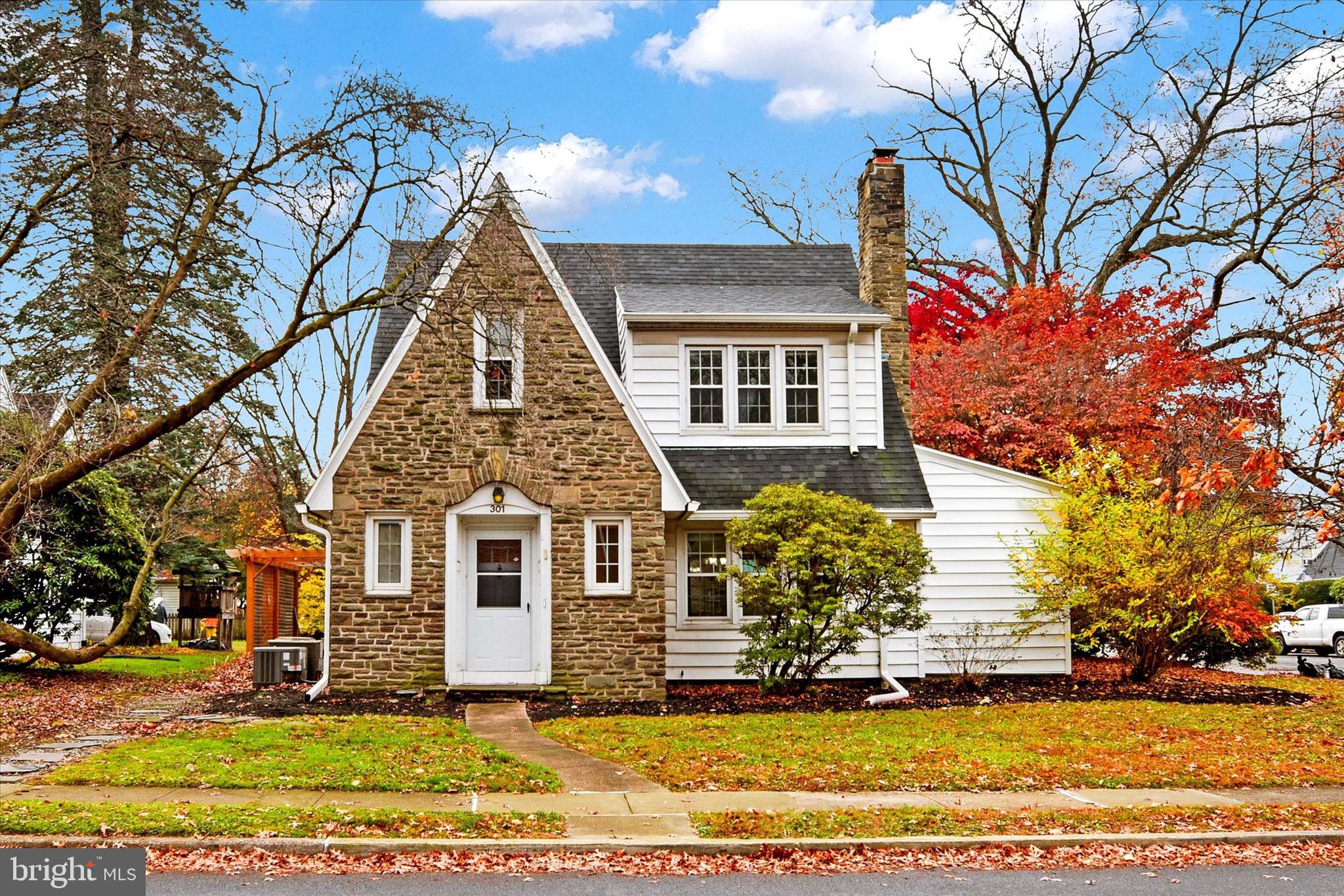 Picture perfect on a corner lot in Susquehanna Twp! Incredible curb appeal with stone accents, sloped roof (installed in 2020!), and the most vibrant established landscaping! The living room is bright and airy with new luxury vinyl plank flooring, charming built-in shelving, and a cozy fireplace. The dining room offers more built-ins, a chandelier, and plenty of room to host the holidays! The kitchen is spacious with great counterspace, sleek black appliances (including double ovens!), and a double window above a double sink. Flex space on the first floor is versatile and useful- could be as an office, playroom, reading nook, sewing space, and more! All 4 bedrooms and 2 full baths are on the 2nd floor. The primary bedroom has storage galore and an attached full bath with tiled shower. Head outside to experience exceptional outdoor living complete with a level yard and paver patio with pergola and privacy fence.  Ample off-street parking in the side-entry driveway. Enjoy peace of mind with a newer roof (2020), hot water heater (2020), furnace (2019), sump pump, and central A/C. Enjoy all the space and privacy this tree-lined street in Montrose Park has to offer while staying just a short drive away from the city, highways, schools, restaurants, shopping, and more!