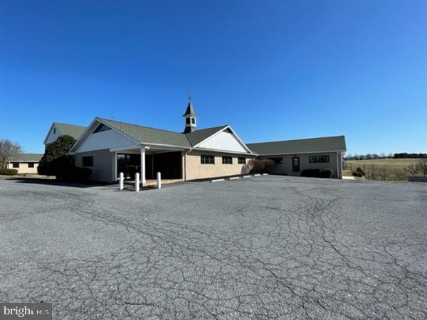 This property will be offered at Public Auction on Thursday, May 12, 2022, at 6pm. The listing price is the opening bid only and in no way reflects the final sale price. 10% down due at auction, 2% transfer tax to be paid by purchaser, real estate taxes prorated
Outstanding one-of-a-kind property is located just minutes from Rt. 83 and PA Turnpike and formally housed a large excavation company and concrete contractor. The approx. 16,000 sq. ft. office/shop is nestled in the center of 80 acres of gently rolling pastures, perfectly framed by white vinyl fencing. The shop housed approx. 30 trucks and heavy equipment for the excavation/trucking company. The 7,450 sq. ft. shop consists of 3 large truck bays measuring 67’ x 21’, 67’ x 21’ and 67’ x 31’7” with complete oil and air systems, hot water pressure washer and electric. In addition, there are 2 smaller overhead garage doors for service vehicles. Included in the shop building are large open spaces for material storage, parts room, over 5,901 sq. ft. of individual office space including dispatch, executive and estimator offices, conference rooms, restrooms, lunchroom and over 1,600 sq. ft. of open office space. Other buildings and improvements include a surprisingly large 3,100+ square feet renovated 2-story home that features 3 bedrooms, 2 full & 2 half bathrooms, nice kitchen, 2nd floor master suite, nicely finished basement, detached 2 story 1,408 sq. ft. horse barn with 4 modern horse stalls, acres of fenced pastures, 4 run in sheds, well maintained farm pond and significant stream.
