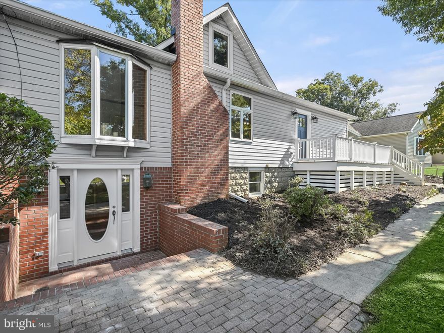 A wonderful combination of thoughtful updates and historical charm. Owned by one family since its construction in 1932, this 4 bedroom, 2.5 bath home has been lovingly maintained over the years. The home features a large gourmet kitchen renovated in 2020. The stainless steel appliances, large island, and white quartz countertops tie in beautifully with hardwood floors and natural wood trim by way of an antique glass display cabinet from the old Elkridge Pharmacy. Enjoy sitting in front of the wood stove on a winter evening or drink your morning coffee on the original front porch-turned-sunroom. On the main level, there are two full baths, a large primary bedroom, two additional bedrooms, and a main level laundry closet. Upstairs, you’ll find finished attic space with a bathroom rough-in. The basement provides another large living area in addition to a newly renovated fourth bedroom and bathroom. The second entrance and laundry hookup give the space plenty of potential to be used as an in-law suite. Outside, the wrap-around deck overlooks a large corner lot featuring a combination of shade trees and sunny spots that are perfect for a garden. The property is conveniently located just minutes from I-95 and MD-100.