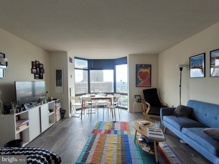 Spacious studio apartment with see-forever city views at the  Wanamaker House. Enter the home through a foyer with three wall closets providing ample storage space. The living/dining space has floor-to-ceiling windows gleaming with natural  light. The well-equipped kitchen features wood cabinetry and a stainless steel appliances. There is a dressing area that leads to a full bathroom with tile floor and a shower/tub. Additional highlights include great natural light and new wood-like vinyl floors throughout. The Wanamaker House is located one block from Rittenhouse Square and provides easy access to both Center City and University City; residents enjoy a 24-hour doorman, a seasonal rooftop pool, a fitness center, and a parking garage available for an additional fee (subject to availability). All common areas were recently renovated including the lobby, hallways, meeting room, amenity lounge, and fitness center, designed by world- renowned architect Cecil Baker. Ask about our leasing incentives.