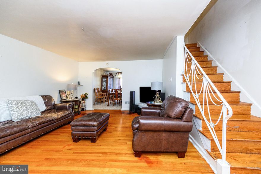 Wonderfully updated 4 bedroom, 2 full bath, spacious home ready for you! Newer Central Air, Roof and finished basement with full bathroom, were installed in the last 4 years. Upon entering, original hardwood floors lead you into the bright living room that flows into a large dining room.  Next to the dining room is an elegant kitchen with timeless tall Cherry cabinets, giving you extra space and style. Access to the back of the home is through the kitchen, as is access to the finished basement with separate entrance. The finished basement has recessed lighting in the living space, a 4th bedroom and full bath. The top level of the home has a light-filled, modernized bathroom and 3 bedrooms. If you are looking for a place close to shopping, schools, public library and transportation, this home is for you!