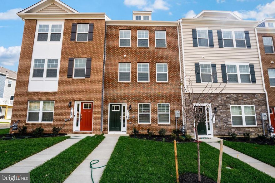 Welcome home to 9712 Ruby Lockhart Boulevard.  This beautiful brickfront townhome offers 3 bedroom, 2 full bathrooms, 1 half bathroom and is conveniently-located and sought after Woodmore Town Center community.

The open concept of the primary living level makes entertaining a seamless with easy access to and from the kitchen to the living and dining areas. The kitchen is fully equipped with adequate countertop space, cabinetry, a large pantry and stainless steel appliances. Retreat to the upper level to find a spacious primary bedroom suite with large closet and en-suite bathroom with dual vanity and stall shower. Two additional bedrooms with ample closet space, convenient laundry room and a full hall bath completes this level. The lower level of this home is the perfect location for a  formal sitting room, playroom, home office or gym and includes a powder room, storage space, and access to the two-car garage. You can’t beat the convenience of this location with walking distance to the pool, clubhouse, tennis court, fitness center, Costco, Wegmans, Nordstrom Rack, and even more shops and restaurants. This is a great location for those who are looking for easy access to the beltway as well - make it yours, today!