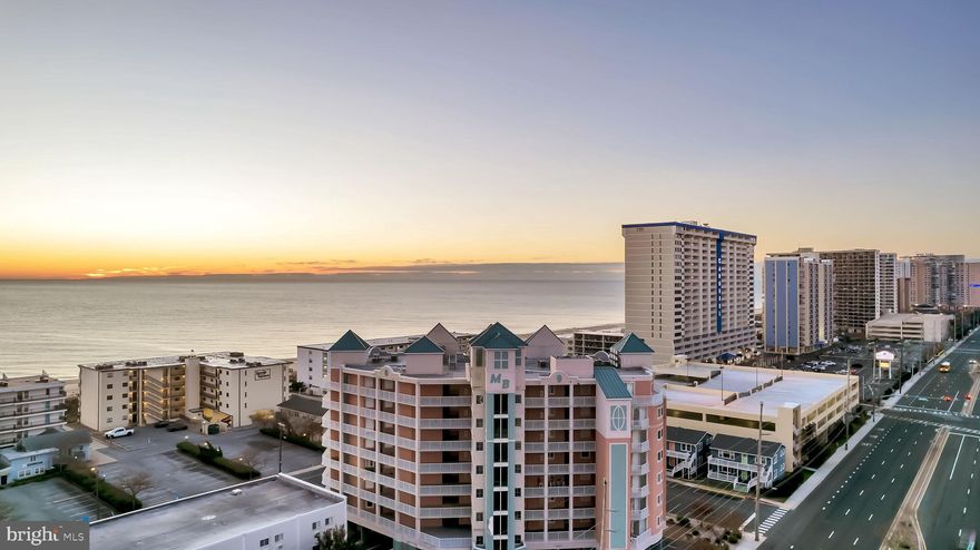 These are the views you have been waiting for! Amazing ocean views and bay views from this luxury three bedroom three bath oceanside condo at Mayfair Beach. You can access your oversized deck from the living room and master bedroom. This is a rare opportunity to own a designer furnished unit in turn key condition. Stainless appliances, granite counters, recessed lights, custom paint, crown molding, wainscoting, owners suite with custom designed walk in closet and spa like bath with separate shower and soaking tub are just a few of the upgrades this unit offers. HVAC, hot water heater, LG refrigerator, LG dishwasher and upgraded washer and dryer are all four years young. This beach home has been a second home only, however it has a tremendous rental potential. Additional storage closet is perfect for your bike and beach gear.  There is a pool for cooling off after a long day at the beach. Steps away from your favorite local restaurants, shopping and Northside Park.