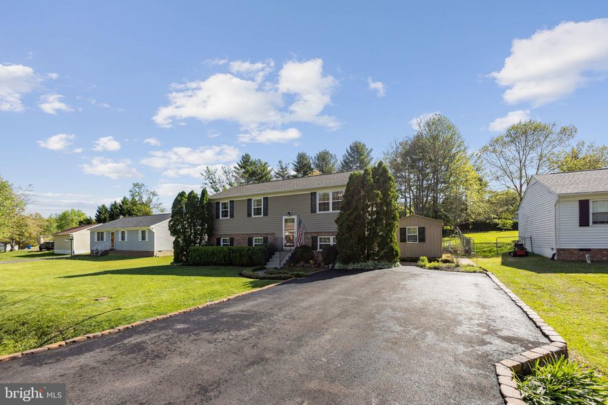 Beautifully Updated 4-Bedroom Home in Vista Woods – No HOA!  Welcome to this updated 4-bedroom, 2-bathroom split foyer located in the sought-after Vista Woods community. Offering 1,920 square feet of functional living space, this move-in ready home combines style, comfort, and convenience. Inside, you'll find updates throughout, including luxury vinyl plank flooring, new carpeting, ceiling fans, light fixtures, and upgraded gutters, downspouts, and a new front door. The stunning kitchen is a true highlight, showcasing updated cabinetry, granite countertops, and updated stainless steel appliances—including a brand new refrigerator (2025)—perfect for both everyday living and entertaining. Both bathrooms have been beautifully refreshed, and key system upgrades like a new water heater and heat pump provide energy efficiency and peace of mind. A hand-painted mural on the exterior adds a touch of artistic charm and curb appeal that makes this home truly one-of-a-kind. Enjoy the added convenience of two backyard sheds offering plenty of storage and flexibility for hobbies, tools, or outdoor gear.  Tucked behind a full fence, the beautifully landscaped backyard feels like your own private park—perfect for relaxing on the freshly stained deck with a good book or cup of coffee. Ideally located just minutes from shopping, schools, commuter lots, and I-95, this home offers effortless access to everything you need. Don’t miss your chance to own this beautifully updated, well-located home—schedule your private showing today!