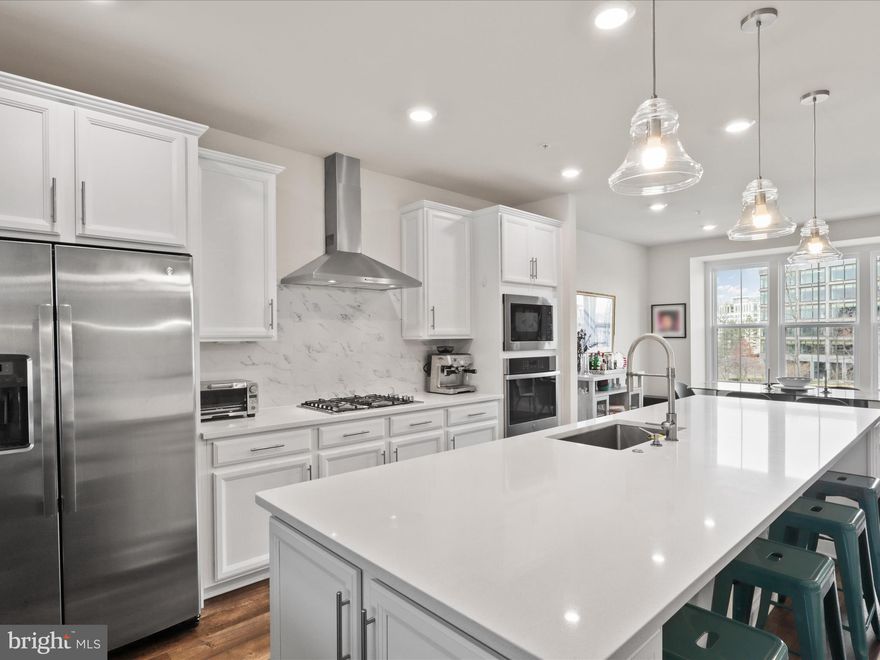 AMAZING location!  SHORT WALK to the Herndon Metro Station!! 2 BLOCKS to the Harris Teeter at Woodland Park Crossing Shopping Center!  

At just 4 years young, this well appointed and well constructed home features a modern, open floor plan perfect for everyday living and entertaining. The chef’s dream kitchen boasts beautiful quartz countertops, stainless steel appliances, and gas cooking. A huge, expansive island with a deep, large sink provides ample space for meal prep and casual dining, while an abundance of cabinetry and a large pantry offer plenty of storage. 

Out back there is a relaxing porch/lanai with a cozy gas fireplace creates a serene spot for outdoor relaxation, and the sunlit separate dining area. The spacious family room features a coffered ceiling and offers plenty of room for a game table or play area, making it ideal for gatherings. 

Upstairs, the fabulous primary suite is a true retreat, featuring a gorgeous bedroom and an enormous closet for all your storage needs. The spacious bath includes a double vanity and a separate water closet for added privacy. Two additional bedrooms, both with large closets, share a hall bath with a tub-shower combo and a double vanity. 

For your convenience, the upper-level laundry makes doing chores a breeze. The home also offers private one-car garage parking, 

Enjoy the community amenities, including a playground, sports fields, sports courts, and picnic tables, perfect for outdoor activities and making memories with neighbors. 

Nestled in an AMAZING location, this stunning property is just a SHORT WALK to the Herndon Metro Station, and 2 BLOCKS to the Harris Teeter at Woodland Park Crossing Shopping Center, Plus, you're just minutes away from Dulles, Reston, and Tysons, offering endless opportunities for entertainment and convenience. 

Open house cancelled.  Although it is under contract showings are permitted until all contingencies have expired.


NOTE:  The front door of the home is on Woodland View Drive.  Google Maps takes you to the REAR of the home.