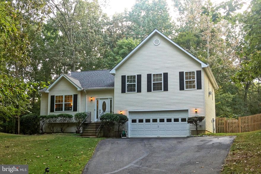 Possible 4th bedroom downstairs.  The room with the bar can easily be converted into a 4th bedroom.  Beautiful home with country kitchen which is combined with dining room.  Deck is off from the kitchen overlooking the backyard and forest.   HVAC system installed this past June 2019.    This house says WELCOME HOME