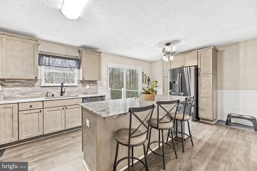 PRICE IMPROVMENT! Now offering an exceptional value in today's market- don't miss this opportunity! This home checks all the boxes. Featuring 4 bedrooms and 2.5 bathrooms, this well-maintained home offers the perfect blend of space, comfort and updates. The large, updated kitchen is ideal for both everyday living and entertaining, complemented by new carpet, new luxury vinyl plank, 
and fresh finishes throughout.  The fully finished lower level provides a spacious rec room- perfect for home gym, or additional living space. Step outside and enjoy the privacy of a full acre of land that is backing to land that is managed by ACLT land trust. 
Recent major updates include a new roof (2023), water heater (2022), and water tank (2019), offering added peace of mind. The property is just minutes from hiking trails, making it ideal for outdoor enthusiasts, as well as close to shopping and restaurants. Roof on the shed is new.  HOME WARRANTY THROUGH FEBRUARY 2027 INCLUDED.