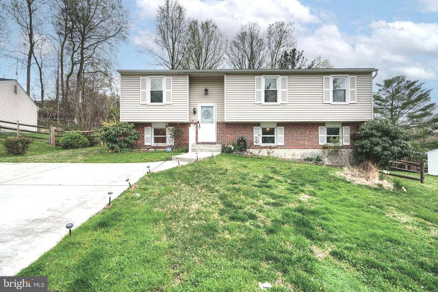 Welcome to 2603 Bradwell Ct, a beautifully maintained split-level home in the heart of Parkville with brand new paint and carpet throughout! This spacious 4-bedroom, 2.5-bathroom home offers a bright and inviting layout with modern touches throughout. Upstairs, the open-concept kitchen boasts stainless steel appliances, a stylish backsplash, and abundant cabinet space. Just off the kitchen, a spacious deck overlooks the fully fenced backyard, providing the perfect setting for outdoor entertaining, pets, or playtime. The main level also includes a spacious primary suite with a full bath, along with two additional well-sized bedrooms and another full bath. The lower level features a cozy bedroom, a convenient half bath, and a walk-out basement that fills the space with natural light, making it perfect for a guest suite, home office, or additional living area. A two-car driveway, quiet street, along with its fantastic layout and desirable location, make this home is a must-see. Schedule your showing today!