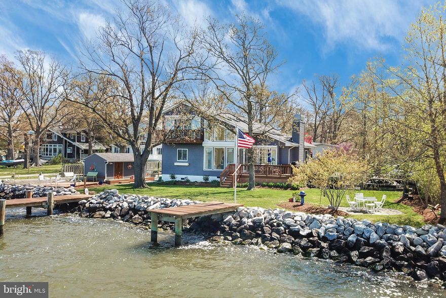 Spectacular sunset views across the West River! Lovely home in a quiet neighborhood w/ an open floor plan, Comfort Shutters, & an expansive master suite.Private docks w/slips & a Magnum boat lift on protected water,  large yard w/multiple decks,& a large storage shed. Easy commute to DC/Baltimore, making this an ideal main residence or weekend retreat.Generator.