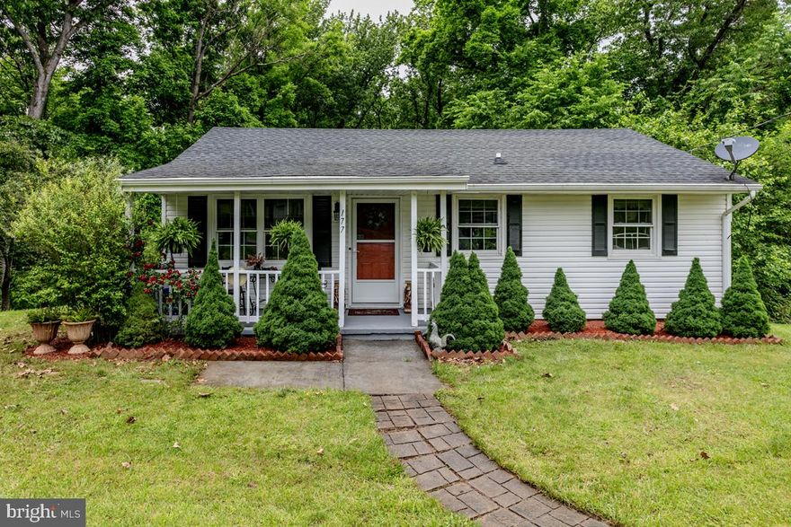 SALE ALSO INCLUDES Lot 790, Tax ID 13C4-4-790, 19,602 square feet/.45 acres.   Beautiful views year-round, lovely floral and fauna, one block downhill to the river, great walk along the Shenandoah and a community picnic area with canoe launch is just icing on the cake included with this adorable cottage.  It even has a covered front porch for enjoying pleasant evenings.  Located about a mile from Christendom College, this bright, airy, and inviting home has been extensively renovated over the last 10 years.  Kitchen and bathroom have been fully updated and feature high-end appointments.  In just the last weeks neutral carpeting and fresh paint give a cozy and serene ambience. This gem has a surprising amount of storage, plus attic, and large shed. The piece de resistance is the professionally built, large, enclosed garden.  Enjoy the good life.  Highlights -- new carpet, freshly painted, new bathroom 2022, updated kitchen has custom designed antique walnut countertop, stainless steel appliances, (dishwasher, stove and kitchen faucet 2023), white cabinets, newer flooring and custom-built floor to ceiling storage case.  There are ceiling fans in every room, windows were replaced 2016, 6 panel doors, front load washer/dryer, window blinds, deck, built in pantry shelves and second pantry, roof 2016, gutters 2020, hot water heater 2020, 2 new window AC units, back door 2020, front & storm doors 2016.   All dates are approximate.   Electric Fireplace DOES NOT CONVEY.  Splitter Heat/Cool conveys AS IS.   Buyer pays sanitary district fee/special assessment and water.