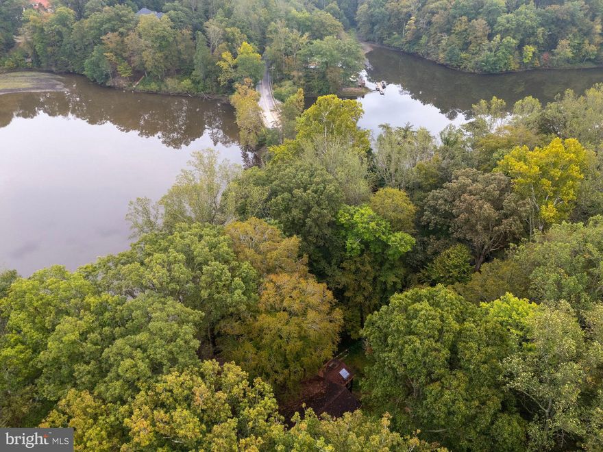 Unique opportunity to own 2 acres of waterfront property in highly sought after Fairfax Station! Located near Fountainhead Regional Park and Bull Run Occoquan Trail. Home is being sold as-is. Well pump replaced a few years ago. In 2021 Dominion replaced the electric mains with a whole house surge protector and spare surge modules. Septic was serviced in May of 2022 with next service due in 2027.   Every year tanks are alternated. Furnace is 5 years old. Contact listing agent for more information. Renovation estimate available.