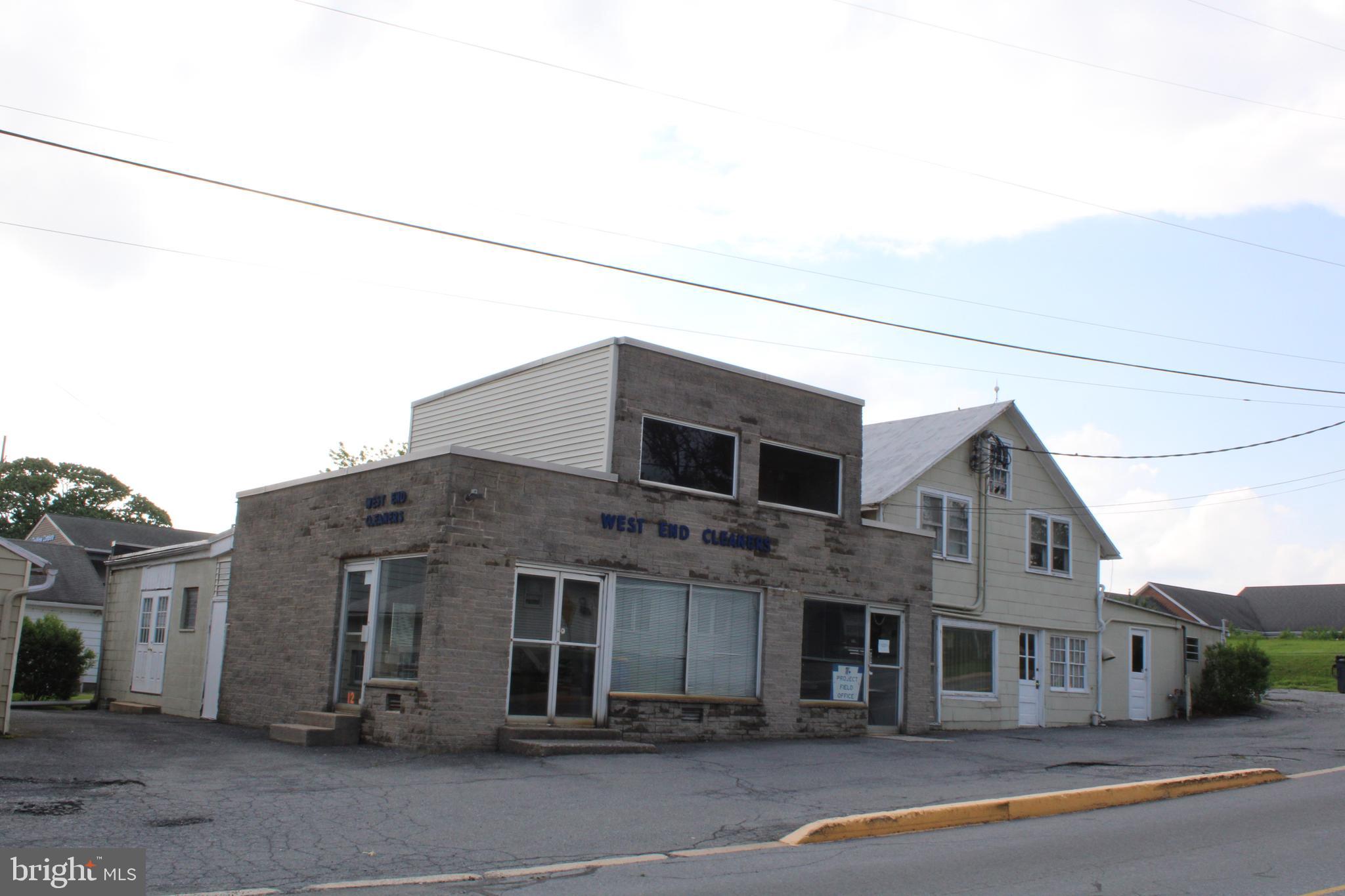 MULTI-UNIT COMMERCIAL PROPERTY FOR SALE IN NEW HOLLAND BORO. Zoned C2. Many possible uses. TRACT Contains two Buildings: Brick 2-unit, 2200 SF, 2-½ story house and Commercial bldg formerly used as a dry-cleaning business. 12 Western Ave. building Contains approx 4694 SF total retail/office space, warehouse, and 2nd floor apartment. Please see additional details under documents & C-2 zoning information.