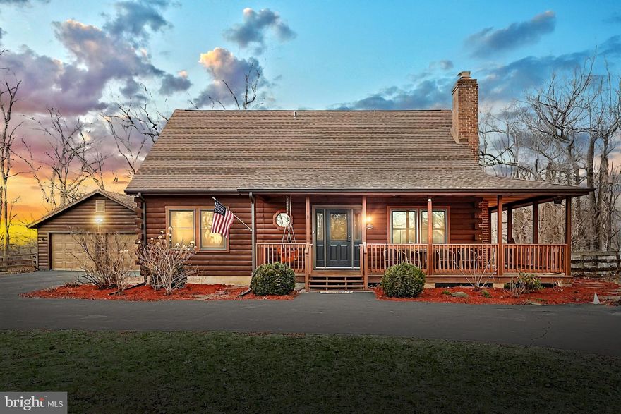 Here's your chance to own a stunning log home retreat, nestled on over an acre and a half of serene beauty in the heart of Carroll Valley! Crafted from premium cedar logs, this charming 4-bedroom, 2-bath home exudes warmth and rustic elegance.  Perfect for entertaining! Enjoy the breathtaking views from the wrap-around porch and spacious deck, ideal for entertaining or simply unwinding in nature.  This meticulously maintained home has many features including one-story living, circular driveway and a 2-car detached garage. 
Tucked away in a quiet, picturesque setting with budding trees and peaceful surroundings, this extraordinary home won’t last long. Don’t miss your chance to own this rare gem—schedule your showing today!