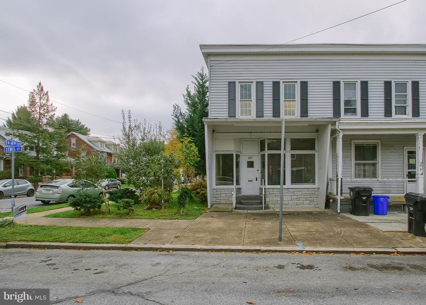 Price just reduced.  Unique property  that used to have business on the 1st floor.  Now being used as large living room, bonus room and 1 /2 bathroom.   Still 2 separate electric meters.  Potential to  have business on 1st floor or to change to 2 unit residential property (subject to zoning approval).  End unit with side and rear yard.  Gas hot water heater and gas forced air furnace.  2nd floor could have 2nd bedroom with replacement of a wall.   Come see the potential options.