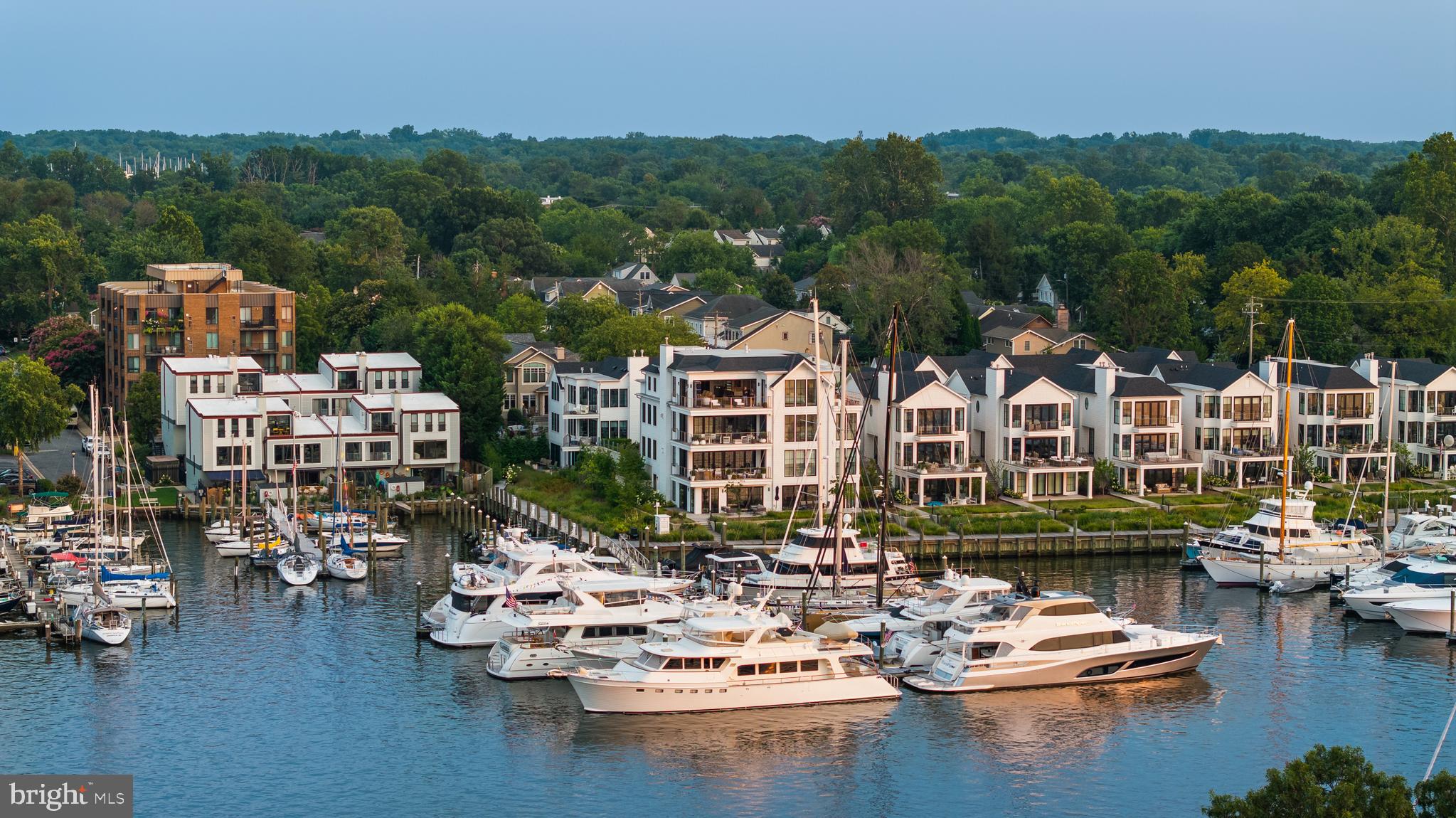 Enjoy Luxury Living on Spa Creek. This is the perfect property for those who seek a serene backdrop to an extraordinary life. With exclusivity and serenity, the Penthouse with 2 guest suites at South Annapolis Yacht Centre Residences combines premier waterfront living with spectacular design that is both timeless and modern. Enjoy breathtaking views of Spa Creek, the Annapolis Harbor and the historic skyline of downtown Annapolis from almost every room and the multiple exterior decks. This property encompasses the stunning Penthouse condo with 3 bedrooms, 2.5 baths and includes 2 guest suites with full baths on the ground level. The guest suites feature waterviews, expansive exterior deck, walls of windows and open floor plans. The suites could be adjoined or used in whatever manner suits your needs. Currently utilized as a gym and a lounge/office space. A balanced combination of clean, modern materials invites natural light to flow through each of the 3 units and the curated finishes are exquisite including polished Cristallo Quartzite slabs in the gourmet kitchen with integrated sink and stunning Waterstone faucet, La Cornue Chateau range with custom hood, marble slabs and vanities in bathrooms, exquisite custom tile, and top of the line Toto toilets just to name a few. The South Annapolis Yacht Centre provides an elegant boutique lifestyle in a marina village setting comprised of 11 Residences and a full-service marina. SAYC is part of the rich Annapolis maritime heritage with 74 new deep water slips (12ft MLW+) to accommodate boats up to 140ft, extensive electrical supply options, waterfront boardwalk, travel lift & direct access to essential marine services. Enjoy the Eastport Lifestyle. Stroll the artful and nautical streets to amenities like; restaurants, pubs and street-end parks. Not to mention you are merely steps away from downtown Annapolis and Naval Academy attractions. Each Residence features waterfront decks & terraces, the perfect outdoor setting for dining al fresco and enjoying glorious sunsets over Spa Creek. Truly an ideal setting for watching the Blue Angels, 4th of July fireworks and the Parade of Lights. Absolutely the best Annapolis has to offer! From this location, you are close to some of the Bay's best cruising and fishing areas. Attractive destinations such as Baltimore's Inner Harbor, St. Michael's, Oxford, and Solomon's Island are only a short cruise away. The historic 18th-century seaport town of Annapolis, Maryland is America's sailing capital. Annapolis offers the perfect balance of small-town charm and big world sophistication. Come home to your Haven! The South Annapolis Yacht Center is located just 5 miles to Rt. 50 and 97 which provides direct access to Baltimore, BWI, Ft.Meade/NSA and Washington, DC. Welcome Home!
