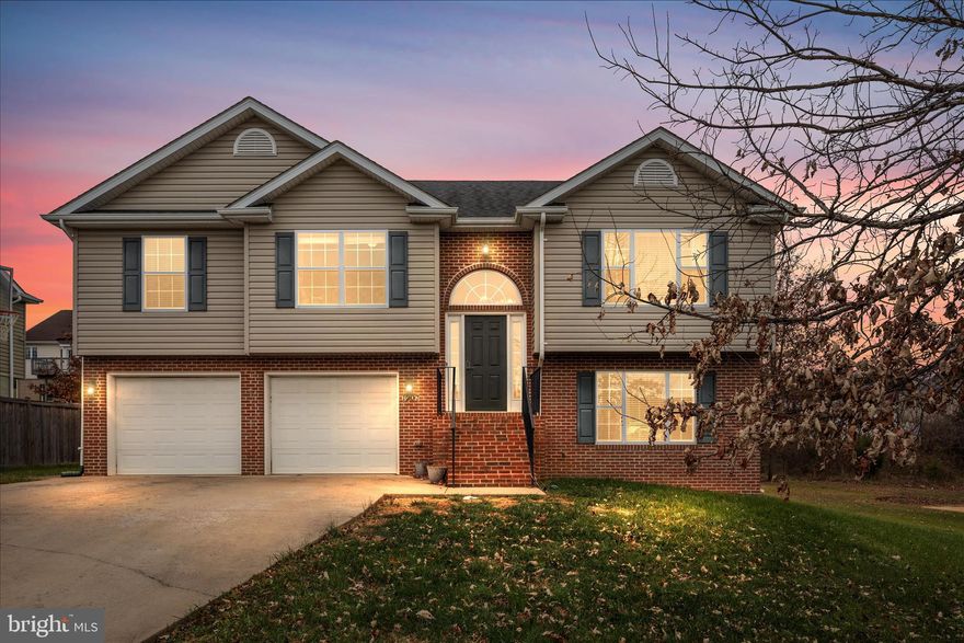Split-Foyer Home with Brick Accents in a sought after location. 
Welcome to this split-foyer home featuring charming brick accents on the front and low-maintenance vinyl siding. Step inside to an inviting open floor plan with a spacious kitchen featuring a large island, an adjoining dining room, and a bright, airy living room—all enhanced by hardwood floors and a cathedral ceiling for an open feel.
The primary suite offers comfort with double vanities, a walk-in closet, and ample natural light. Thoughtful upgrades throughout the home include a bay window, elegant sidelights, and a striking starburst window.
Enjoy outdoor living on the 12' x 12' deck, perfect for relaxing or entertaining. The lower level features a finished basement with a large family room and a third full bath, offering flexible space for guests, recreation, or a home office.

Additional highlights include:

Brick front steps with iron railing

Two-car front-loading garage

Concrete driveway on a paved, dead-end street

Convenient access to Leach Run Parkway and I-66

Minutes to the hospital, sidewalks;  priced under current appraisal
